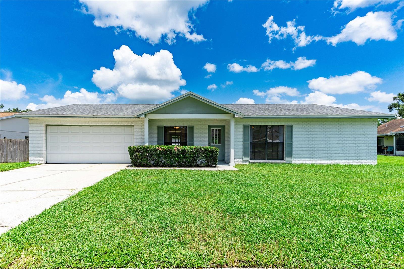 Welcome Home to Brandon Living! Discover this spacious 4-bedroom, 2-bath single-family home with a dedicated office, perfectly tucked away in a quiet neighborhood yet close to everything Brandon has to provide. From the moment you step inside, you’ll love the open-concept design that seamlessly connects the kitchen, dining room, and living room—ideal for both everyday living and entertaining. The heart of the home is the modern kitchen, featuring stainless steel appliances, a center island, and plenty of cabinet space for all your culinary needs. Ceramic tile flooring flows through the main living areas for easy maintenance, while plush carpet in the bedrooms adds comfort underfoot. Enjoy the privacy of a split floor plan: the primary suite is set apart with its own ensuite bathroom, step-in shower, and ceiling fan, while three additional bedrooms and a full bath provide ample space for family, guests, or hobbies. A convenient indoor laundry room sits just off the attached two-car garage for added functionality. Step through sliding glass doors to the screened lanai, the perfect place to unwind with a good book, host friends, or watch your family play in the fenced backyard that offers space to garden, play, or simply relax in the Florida sunshine. Beyond the home, you’ll appreciate the central location—close to shopping, dining, schools, and premier medical facilities—making daily errands and leisure time a breeze. Don’t miss the chance to make this Brandon home your own. Schedule your private showing today and start living the lifestyle you’ve been waiting for!
