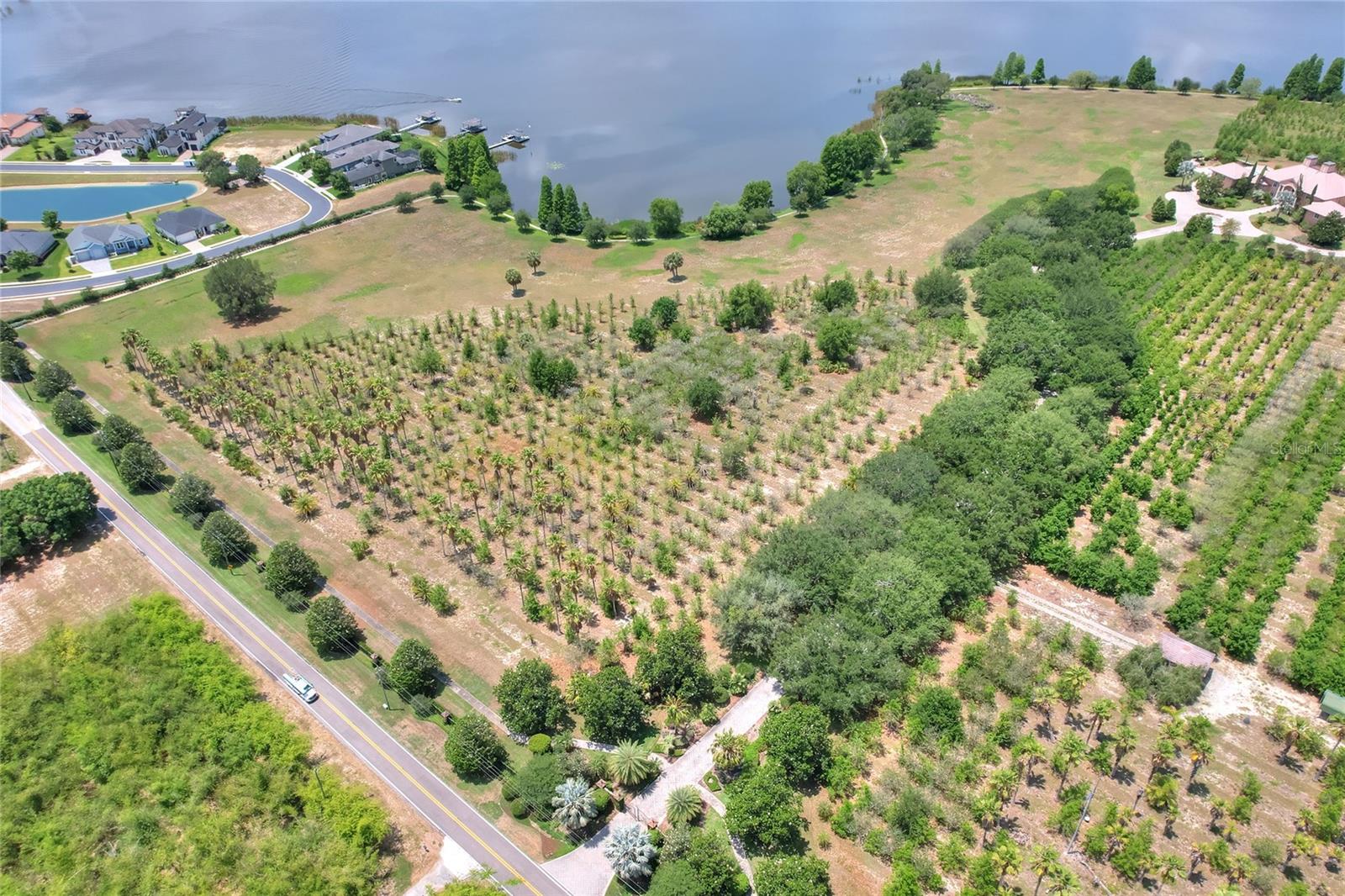 **Lakefront Paradise in Auburndale – Prime Development Opportunity** Discover a rare opportunity to own stunning lakefront acreage on the shores of Lake Van, located within the city limits of Auburndale and just 6 miles from Interstate 4, offering both tranquility and convenience. This beautiful property boasts 1749 feet of pristine lakefrontage, providing panoramic water views and direct access to one of Central Florida’s most picturesque lakes. With expansive open space and mature trees, it's the perfect canvas to build your private estate, family compound, or a high-end residential development. The parcel offers generous dimensions and natural beauty, creating endless possibilities for visionary builders or discerning buyers seeking the best of lakefront living. This listing, consisting of two lots, can be split with certain restrictions. Whether you dream of your lakeside retreat or a premier development opportunity, this property offers unmatched potential in a rapidly growing area. See picture 4 or 19, this listing includes parcels labeled as #4 and #5.