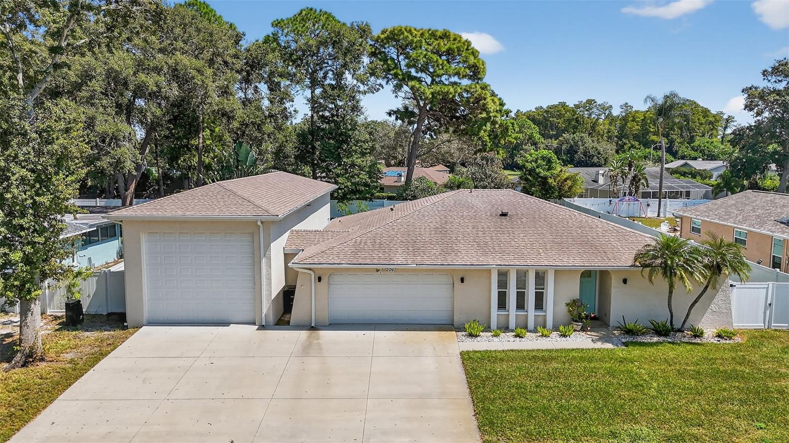 Nestled in a prime Clearwater location, this stunningly updated home at 3267 Fox Hill Drive offers the perfect blend of modern luxury and convenient living. Situated in a desirable community, you're just moments from Clearwater's pristine beaches, vibrant downtown, and a wide array of dining, shopping, and entertainment options. Best of all, this property boasts the freedom of no HOA and is located in a non-flood zone, providing peace of mind and lower insurance costs.
Step inside and discover a sanctuary that has been meticulously remodeled from top to bottom. The home features brand-new, waterproof laminate flooring installed in 2021, creating a seamless and stylish flow throughout the main living areas, with durable tile in both updated bathrooms. The gourmet kitchen is the heart of the home, boasting elegant solid surface countertops and a suite of high-end appliances, including an LG refrigerator, a Bosch dishwasher, and a new Frigidaire slide-in stove.
This property is truly turn-key, with all major systems recently replaced for worry-free ownership. Enjoy the peace of mind that comes with a new roof (2020), a Trane AC unit (2020), and a new electrical panel (2021). Further enhancements include a new water heater and a whole-house water filter, both installed in 2021.
The private backyard is an entertainer's paradise. The sparkling pool was beautifully resurfaced in 2021 and features a new salt system with a programmable pump and control panel. The expansive yard is kept lush and green year-round by a sprinkler system powered by one of four private wells on the property.
For the car enthusiast or hobbyist, the newly constructed 18x60 garage, built in 2021, is a true standout. With two 14-foot wide by 12-foot tall doors, it offers an exceptional amount of space for vehicles, storage, or a workshop.
Additional thoughtful upgrades, such as new LED lighting throughout and a new sprinkler system brain (2022), complete this exceptional property. This is more than a home; it's a completely renovated sanctuary in a fantastic Clearwater location, ready for you to move in and start living the Florida lifestyle.