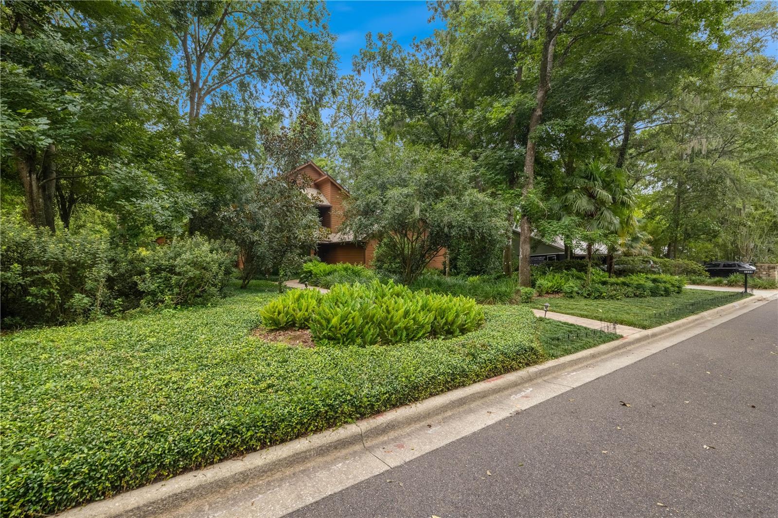 This stunning one-owner, custom-built home is a true gem, showcasing designer touches throughout and nestled in a great neighborhood just minutes from UF. Enjoy the perfect blend of privacy and serenity with a lush backyard that backs up to a peaceful creek, ideal for relaxation or entertaining. The home boasts a luxury screened-in swimming pool, perfect for year-round enjoyment.
Inside, the split floor plan offers privacy and functionality, with soaring ceilings and a light and bright interior that enhances the spacious feel. The custom kitchen features granite countertops, premium finishes, a gas countertop range and grill, two appliance garages, a deep large sink, a bar sink with a big center island, and ample storage—ideal for any home chef.
An oversized garage provides extra space for vehicles or hobbies. The large lanai with a travertine pool deck includes custom-built safety rails. The lush landscaped lot backs to Hogtown Creek.
The downstairs features a bedroom with a newly renovated full bath. The upstairs landing and master both have access to the second-story deck overlooking the pool and the native backyard. Built-ins are found in the master and living room. There is also an oversized laundry room with storage and a sink. Two additional bedrooms and a bath upstairs feature a pocket door to guarantee privacy. The primary suite features a walk-in closet, built-ins, and a bath with double sinks, a private toilet area, a tub, and a shower.
With so much more to offer, this home is a must-see!