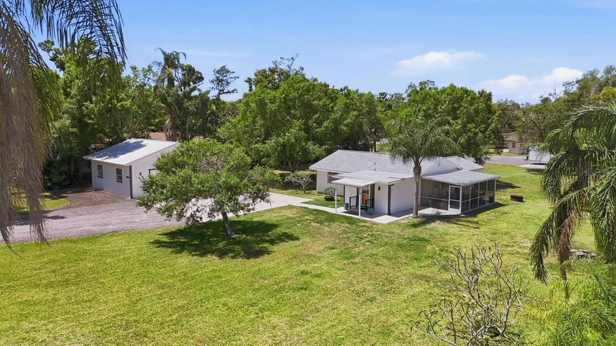 Rare opportunity to own a private retreat with space, flexibility, and an unbeatable location—all set on nearly an acre (.80 acres) in Sarasota. Properties like this are incredibly hard to find, offering no HOA, no CDD fees, and no deed restrictions. This well-maintained 2-bedroom, 1-bath home has been thoughtfully updated and offers excellent potential for expansion. Recent improvements include a new HVAC system, water heater, washer and dryer (2021), new kitchen appliances (2024), and a new shingle roof on the home along with a metal roof on the detached garage (2023). Set back from the road for added privacy, the property features a spacious open floor plan with flexible living options to suit a variety of lifestyles. The large lanai just off the kitchen and living area creates a perfect indoor-outdoor flow for relaxing or entertaining. One of the standout features is the impressive 30’ x 30’ detached garage, complete with two garage doors, an attached shed for additional storage, and its own electrical panel with a 220-amp receptacle—ideal for a workshop, business use, or hobbyist needs. With ample space for storage, recreation, or future customization, this property offers endless possibilities. Enjoy the privacy of a large homesite while being just minutes (approximately 5 minutes) from schools, shopping, dining, and Sarasota’s beautiful beaches. Move-in ready and full of potential—this is a truly unique opportunity you don’t want to miss.