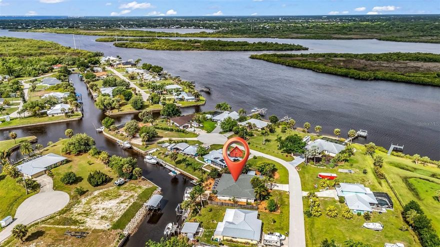 Completely remodeled waterfront gem with direct access to the Peace River and beyond to Charlotte Harbor—this is Florida living at its finest! Situated on an oversized fenced lot with tropical landscaping that's on another level! The property has one of the coolest Gumbo Limbo trees outside of the Keys that provides shade without risk of damaging the house! There's an array of fruit trees including pomegranate, miracle berry, mango, avocado, papaya, guava, grapefruit, fig and lime! This property offers both space and style in a prime boating location, featuring an oversized dock perfect for accommodating larger vessels!
Inside, the heart of the home is a stunning, fully updated kitchen designed for both everyday living and entertaining. Enjoy abundant cabinet space, brand-new stainless steel appliances including a wine fridge, and beautiful quartz countertops with both bar-height and counter-height seating options. The bathrooms are also updated with new soft close cabinets, quartz countertops, new sinks faucets and show heads. 
The home showcases luxury vinyl flooring throughout, hurricane shutters, NEW ROOF (2023) and hurricane rated garage door for peace of mind, fresh interior and exterior paint, and a freshly epoxied garage floor for a clean, polished finish.
Whether you're relaxing indoors or enjoying the waterfront lifestyle outside on your screened lanai with additional brick paver patio beyond, this home checks every box—modern upgrades, generous space, unbeatable access to open water and room for a pool. A true move-in-ready waterfront retreat!