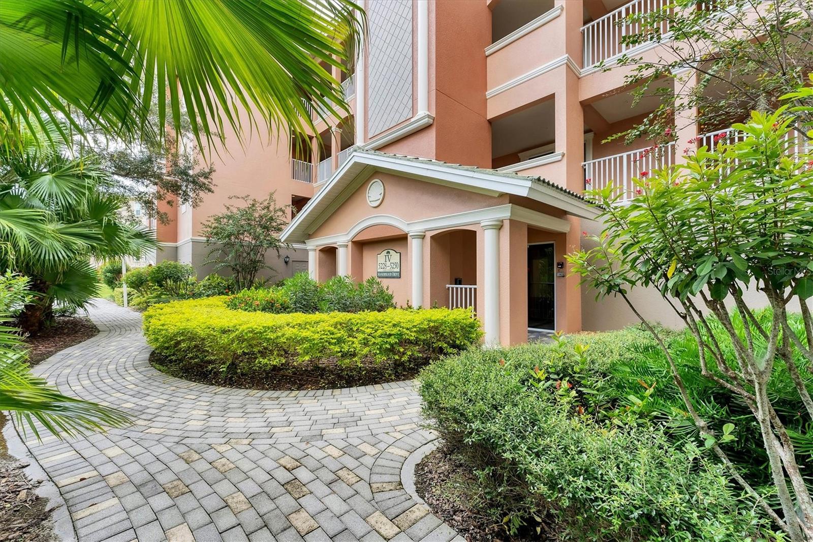 Penthouse perfection meets unbeatable Sarasota location! Welcome to 5246 Manorwood Drive, Unit #4 – a rarely available top-floor penthouse in the prestigious Grande Oaks Preserve. Built by Tandem Construction with solid concrete block construction, this elegant residence offers unmatched quality, security, and serenity in a prime, gated setting just minutes from everything Sarasota has to offer. This spacious 3-bedroom, 2-bath home spans nearly 2,000 square feet and features 12-foot tray ceilings, 8-foot solid wood interior doors, and 6-inch concrete floors between units for ultimate sound privacy. Crown molding, solid wood cabinetry, and granite countertops elevate every corner of this beautifully designed home, while the open-concept layout flows seamlessly to a private screened lanai—perfect for relaxing and enjoying peaceful views. Enjoy the convenience of elevator access, in-unit laundry, and an air-conditioned storage room, along with two deeded garage spaces in the secured garage. This maintenance-free, no-CDD community is ideal for full-time residents or seasonal getaways. Living in Grande Oaks Preserve means resort-style amenities right at your fingertips—year-round heated pool, two spas, tennis and pickleball courts, a fully equipped fitness center, and a gated entry for added peace of mind. And then there’s the location—walk or bike to UTC Mall, Nathan Benderson Park, Whole Foods, and dozens of top-rated shops and restaurants. In just a short drive, you can explore Downtown Sarasota, Lakewood Ranch, St. Armands Circle, and the world-famous beaches and waterways of Florida’s Gulf Coast. Quiet, private, and perfectly located, this penthouse condo offers the best of Sarasota living—furniture is also available for a truly turnkey experience. Don’t miss your chance to own this rare gem. Schedule your private tour today!