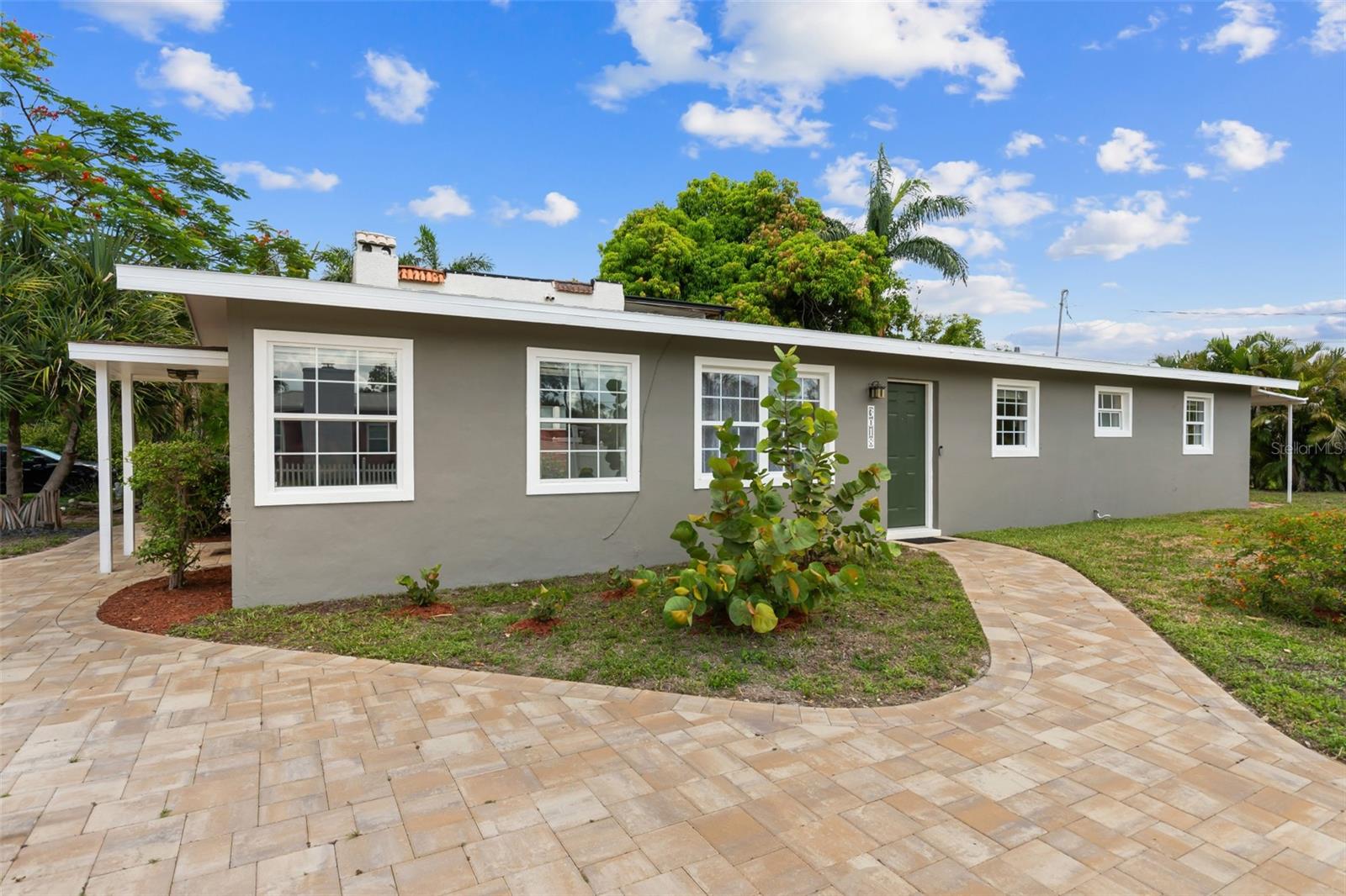 Bundled service pricing available for buyers. Contact the agent for details. Welcome to your dream home in the desirable Riverside Park neighborhood of Old Fort Myers—where timeless charm meets modern convenience. This beautifully updated 1,334 sq ft, 3-bedroom, 2-bath home with a large office/den was renovated in 2015, boasting significant upgrades throughout: a new roof, energy-efficient windows and doors, updated ductwork and air conditioner, new hot water heater, and a new stackable washer and dryer. The thoughtfully redesigned kitchen features a stylish breakfast bar, crisp white cabinetry, and granite countertops that complement the elegant tile flooring that flows seamlessly throughout the home. The bathrooms maintain a Mid-Century modern flair, skillfully blending vintage and contemporary tiles for a unique, retro-inspired ambiance. Abundant natural light pours into the spacious living and dining areas, as well as each of the three bedrooms and the large bonus room—ideal for a home office, guest space, or playroom. Outside, enjoy your own tropical retreat. The fenced backyard features mature landscaping, paver walkways, a new fence, and a covered brick lanai perfect for entertaining or relaxing. A brand-new circular paver driveway accommodates up to four vehicles, and the oversized lot includes additional space for a trailer or boat. Located just minutes from downtown Fort Myers, the historic Ford & Edison Estates, McGregor Boulevard, Edison Mall, and top dining and entertainment spots, this home puts you at the center of everything. Enjoy easy access to RSW Airport, JetBlue Park, and area beaches—all while living in a peaceful, dog-friendly neighborhood with a rich local history. High and dry with no flood insurance required, freshly painted inside and out, and surrounded by lush greenery—this home truly offers the perfect mix of style, comfort, and convenience. Don't miss your chance to live just off McGregor without the million-dollar price tag. Schedule your showing today and experience the charm of Old Fort Myers living!