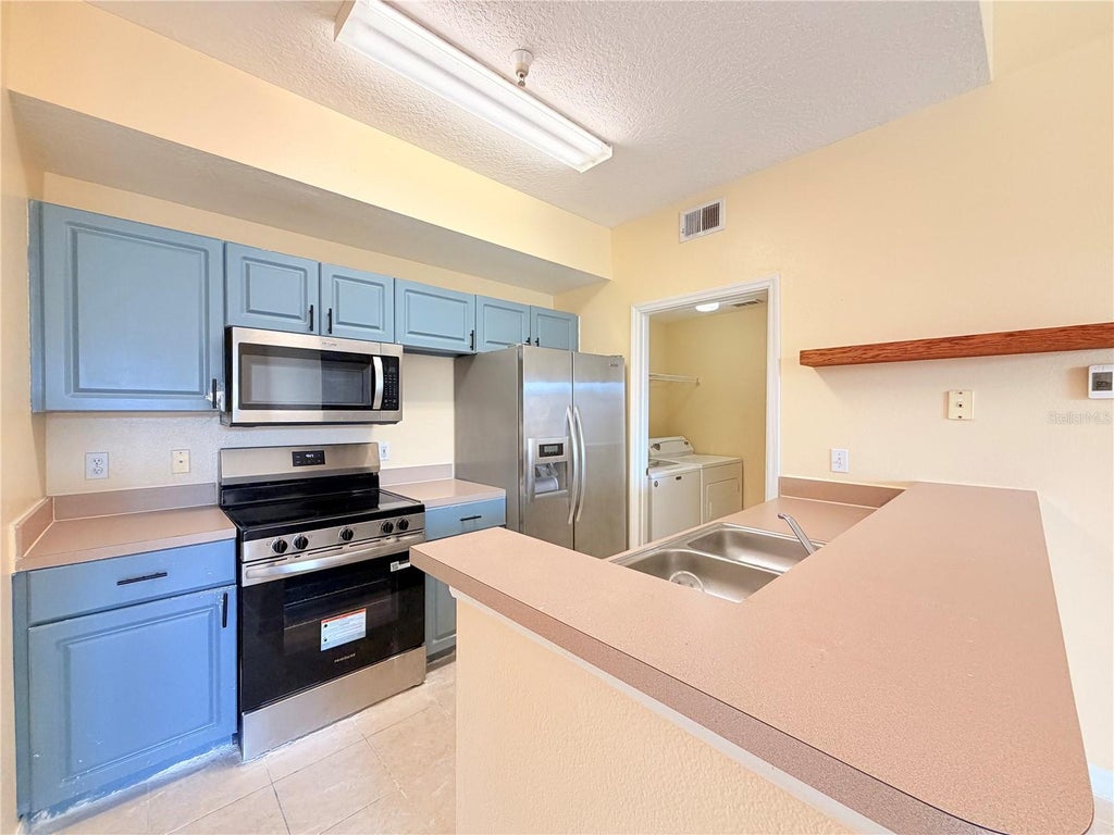 Photo of 5500 Metrowest Boulevard #14-308, Orlando, FL 32811 (MLS # O6447721)
