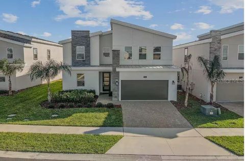 Photo of 913 Ocean Course Avenue, Davenport, FL 33896 (MLS # O6402821)