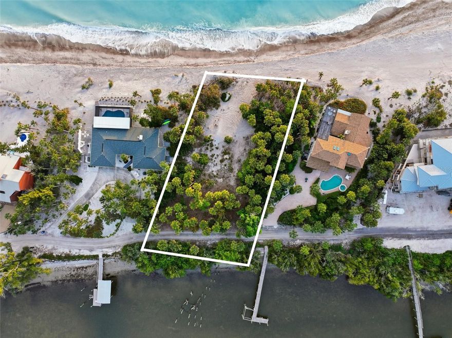 Welcome to a truly rare opportunity on the north end of Manasota Key—where privacy, natural beauty, and endless potential come together on an extraordinary 1.06-acre homesite.

Perfectly positioned between the Gulf of Mexico and Lemon Bay, this unique property offers water on both sides—delivering breathtaking sunrise views over the bay and unforgettable sunsets over the Gulf. With front and rear water vistas, every angle of your future home can be designed to capture the beauty of coastal living.

Tucked behind a private gate with fewer than 80 residences, this exclusive enclave offers a level of seclusion that is increasingly hard to find. Here, you’ll experience the serenity of barrier island living while still being just a short drive to dining, shopping, and everyday conveniences.

The property also features a private dock, with the opportunity to rebuild and customize with a lift—making it effortless to enjoy boating, fishing, and exploring the surrounding waterways right from your backyard.

With over an acre of land, dual waterfront exposure, and endless design possibilities, this is more than just a homesite—it’s a chance to create a legacy property in one of the most coveted and private stretches of Manasota Key.

Build your dream home, design your ideal waterfront lifestyle, and experience coastal living the way it was meant to be—private, peaceful, and truly one of a kind.