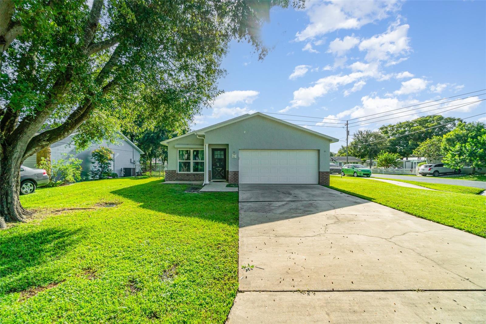 Investor Special – AS-IS Opportunity in the Heart of St. Cloud! Welcome to 443 Wyoming Avenue, a 3-bedroom, 2-bath single-family home offering 1,185 sq. ft. of living space on a 9,583 sq. ft. lot. This property already has major system upgrades completed in recent years—including a new roof (2022), HVAC (2023), water heater (2023), windows (2022), exterior paint (2022), interior was also repainted (2025), refrigerator (2024), and a new garage door (2025)—plus consistent tile flooring throughout. The interior, however, is unfinished and ready for your vision. The home currently needs kitchen cabinetry, counters, sink, and appliances, along with bathroom vanities and one toilet. Some lighting fixtures and vents are also not yet installed, though wiring and ductwork are in place. Set on a spacious corner lot with no HOA and located in a desirable neighborhood just minutes from historic downtown St. Cloud, East Lake Tohopekaliga, lakefront parks, and pickleball courts, this property is perfect for investors or handy buyers looking to add value. With comps in the $310K–$335K range, this home is priced to sell at $269,900 as-is—giving the next owner instant equity once the finishing touches are complete. Cash, conventional, or renovation loan buyers welcome. Don’t miss this opportunity—schedule your showing today!