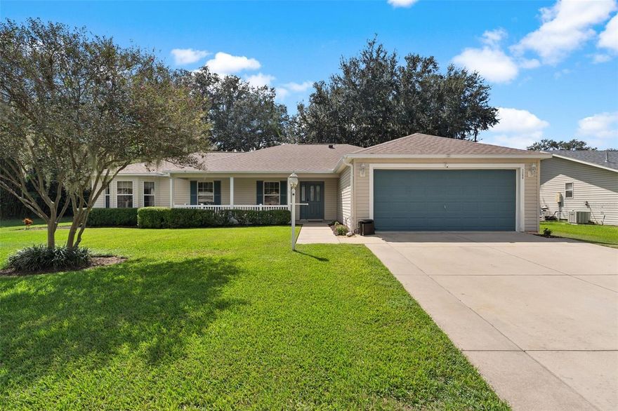 Looking for an amazing home near The Villages but not right inside of it...well look no further! This perfect home and neighborhood is located off of County Road 466 and features 4 bedrooms and 2 baths . ROOF 2022 and AC 2021! From the moment that you pull in the driveway you will notice the meticulous oversized yard. Imagine cool evenings rocking in your rockers on your beautiful front porch. As you enter, the stunning laminate floors throughout will catch your eye. Large living room, kitchen overlooking the back yard, and dining area all flow nicely together in this layout. Primary room with walk in closet and glass shower. Split bedroom plan with bedrooms 2-4. You will love your new large screened in back patio which features plenty of room for a hot tub! Location is everything and this home is located just minutes to all the shopping, restaurants, medical facilities and so much more! Saves you time and gas! This one will not last long...call today to make it yours!