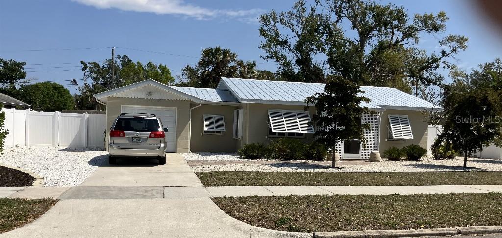 Charming cottage will soon leave the market for the remainder of the year so don’t overlook this marvelous GOLF-GULF opportunity: 2 mi to G.T.Bray Park; 3 mi to IMG Academy.
A trifecta location, location, location find is just 200 yds to Bradenton Country Club and minutes to Anna Maria Island’s white sand public beach (6 miles) sharing among the highest elevation points in Manatee County as another plus. This solid home boasts a tasteful interior with all new or newer mechanicals: metal roof (2021), built-in steel window shutters (2024), 140+mph rated garage door (2024), water heater (2021) NEW HVAC + new attic ductwork (and extra attic insulation (2023).
Beautifully updated, lovingly maintained! Snowbird owners of 15 years offer this gem FURNISHED. Hang-up your clothes, sit back and enjoy! Spacious living room, spacious kitchen (with commercial size French door, bottom freezer) plus bonus room: is it a dining room? a study? or with a surprise Murphy bed--is it a third sleeping area in this two bedroom home? There is plenty of indoor space for family, friends and guests. Outdoor plus-sized lot reveals 50' of deck to patio with steel and canvas gazebo for shaded dining. The spacious yard presents numerous creative expansion possibilities. But all within the time-saving landscape design of extensive Xeriscaping (hardscape: stones and shell) to minimize watering and mowing. Three black olive; “Shady Lady” trees planted in 2023 grace the curb appeal on this quiet street.
Come, see, be impressed.
