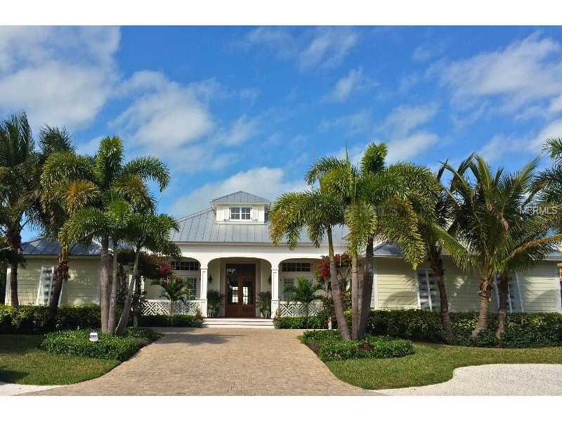 Stunning custom home in Boca Grande Isles located on deep water canal with state of the art dock facilities capable of mooring 100 foot boat, gourmet kitchen, open floor plan, infinity pool, hurricane impact glass on all openings, beautiful landscaping, serene views surround.