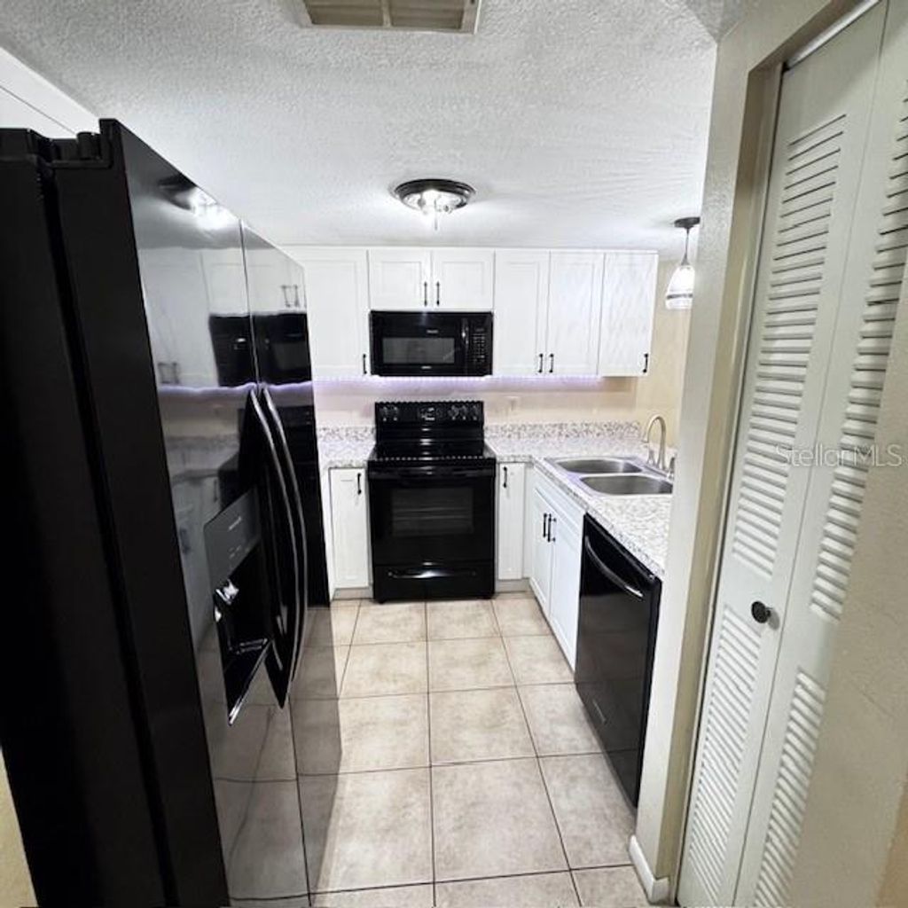 Photo of 10128 Lake Oak Circle, Tampa, FL 33624 (MLS # TB8504311)