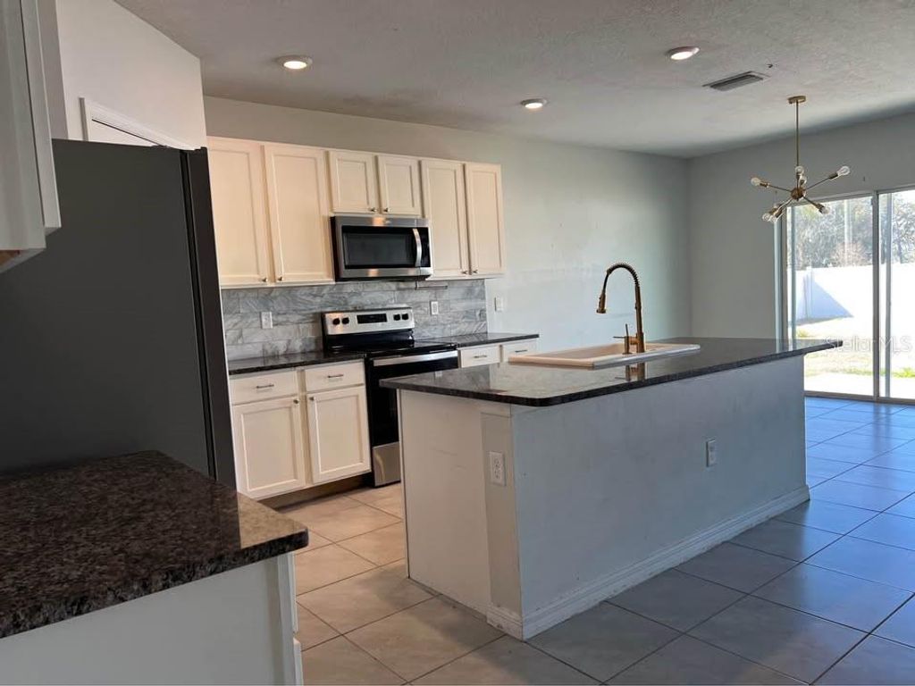 Photo of 1703 Johnson Pointe Drive, Plant City, FL 33566 (MLS # TB8472648)