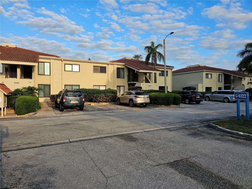 Welcome to this 2-bedroom, 2-bathroom condo offering the perfect blend of comfort and style. The updated kitchen is a standout, complete with modern white cabinetry, sleek quartz countertops, stainless steel appliances, and a stylish tile backsplash. A breakfast bar opens seamlessly to the living and dining spaces that is ideal for entertaining or everyday living. Step into the spacious living area enhanced by large sliding glass doors that fill the home with natural light while offering golf course views. The screened-in lanai provides the perfect spot to relax and unwind, overlooking the lush green and fairway. The primary bedroom is generously sized and includes an en-suite bathroom and a walk-in closet. Bathrooms have been tastefully renovated with updated vanities, and clean, modern finishes. A convenient in-unit washer and dryer adds everyday ease and functionality. The secondary bedroom offers flexibility for guests, a home office, or personal retreat. This unit includes ample storage throughout and an assigned parking space (#11) for added convenience. Located in a quiet, well-maintained community, this condo offers a low-maintenance lifestyle with scenic surroundings—perfect as a full-time residence, seasonal retreat, or investment opportunity. Take advantage of a golf, tennis, yacht or social membership offered at Isla Del Sol Yacht & Country Club. All of this, and within minutes of the award-winning beaches of Fort Desoto State Park, and top ranked St Pete Beach. Or with easy access to I275, you're only 15 minutes to the vibrant activity of the nightlife, restaurants and shopping in downtown St Petersburg.