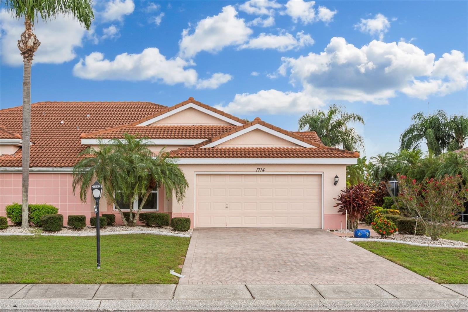Welcome to your serene lakefront retreat in the heart of Sun City Center! This Newly Renovated and Updated Madeira model offers 2 spacious bedrooms, 2 baths, and a versatile den/office – ideal for remote work or extra guest space. Spectacular Lake Views from nearly all rooms! Step into a modern, open-concept layout featuring a sleek kitchen with quartz countertops, New stainless steel appliances, and upgraded finishes throughout. The primary suite is a true sanctuary, complete with dual vanities, a relaxing tub, a separate walk-in shower, and a fully renovated bathroom. The oversized screened lanai invites you to unwind with stunning lake views, perfect for morning coffee or evening sunsets. Recent upgrades include, without limitation: new stainless steel kitchen appliances; new kitchen counter, flooring and refreshed cabinets; new flooring in bedrooms; new flooring in bathrooms; new bathroom fixtures and shower; new lanai flooring; new door fixtures in front; new epoxy garage floor coating; new electrical panel; new water heater; screen upgrades; and more--over $55.000.00 in improvements at cost! Located in a vibrant 55+ active lifestyle community, residents enjoy access to world-class amenities, recreational activities, including a fitness center, pool, craft facilities and golf courses. All of these items are a short distance from residence. In addition, the residence is just a short drive from Tampa Bay, airports, and cruise terminals. Don’t miss your chance to make this lakeside beauty your home – schedule your private tour today!