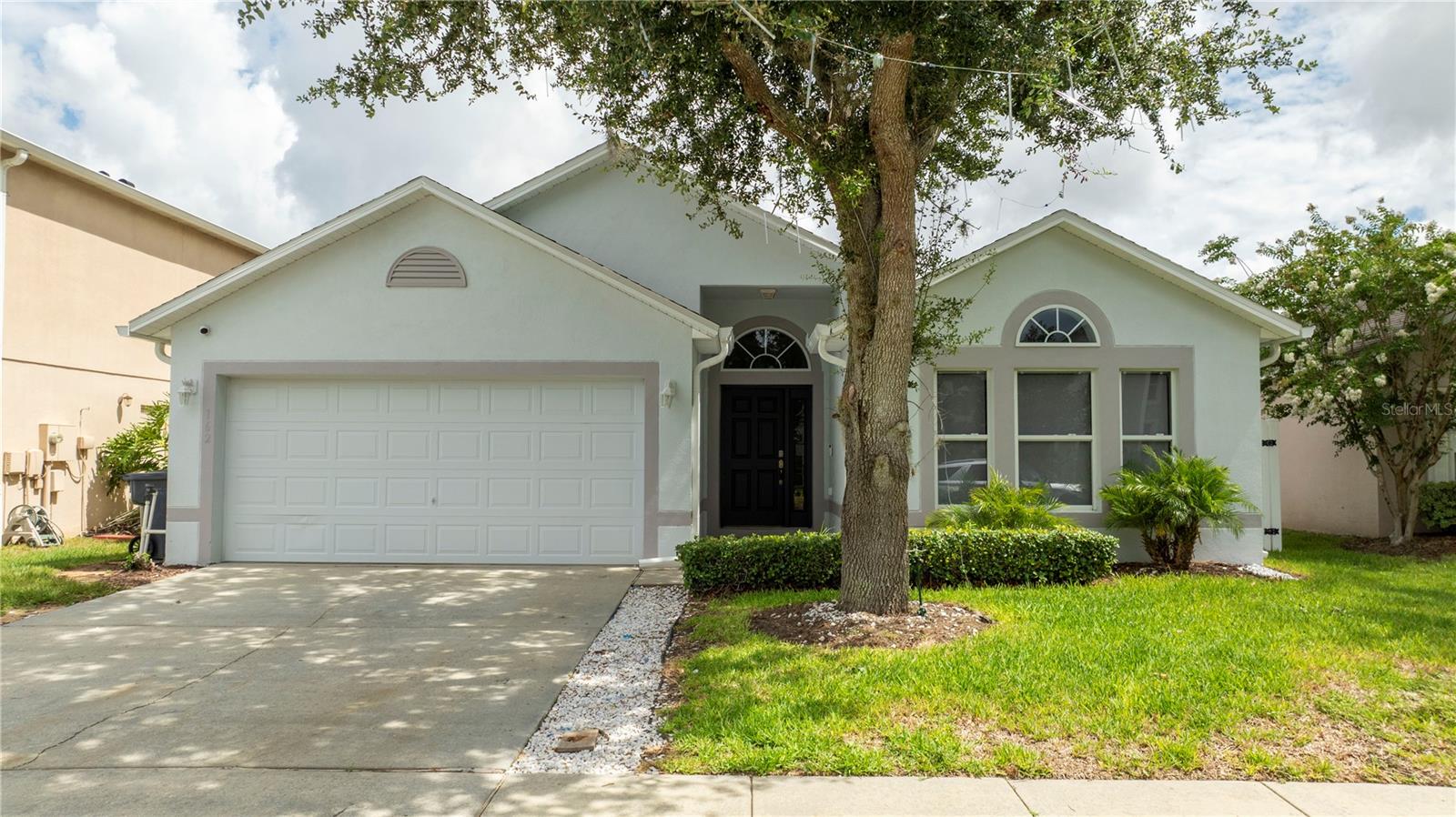Welcome home to this 4 bedroom, 2 bathroom home in The Center community within Legacy Park. NEW ROOF. Fully renovated, Spacious floor plan with vaulted ceilings gives the home an enjoyable open feeling. Whip up your favorite meals in the eat-in Kitchen including with stainless steel appliances and a brand new island with Quartz. The decorative backsplash and laminate flooring gives it that extra designer touch. Large living room and dining area making it a breeze to entertain your guests. There are three other ample sized bedrooms. Sliding doors led you out to the large, covered, screened enclosed patio overlooking the backyard. Enjoy your privacy with the white vinyl fence that gives access to the back easement. The easement provides a great little space between you and your rear neighbor. Additional features include A/C 2020 with digital Nest thermostat, BRAND NEW FLOORS throughout the main living areas and bedrooms. Charming community playground / park area with pavilion to take advantage. This location is what you have been searching for... Just off US27 near 192 putting you near the theme parks, dining, shopping and entertainment. Northeast Regional Park is also nearby with new baseball fields, dog park, hand ball, tennis court, basketball court and soccer field Don't miss out!