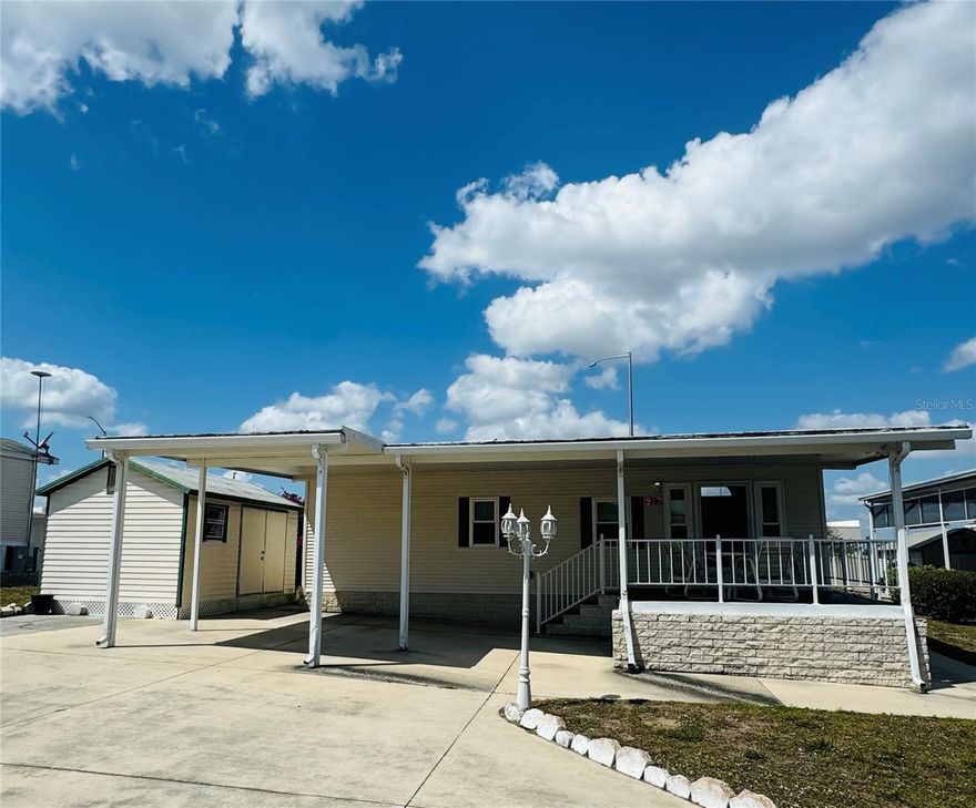 Welcome to DEER CREEK RV GOLF & COUNTRY CLUB!  It’s the perfect time to purchase your new FLORIDA GETAWAY!  Whether you are looking for a sunny place to winter or a full-time residency, this two-bedroom, two-bath, well-maintained park model is perfect!  Situated on two lots in Osprey Point, this home boasts an open floor plan with living, kitchen & dining room! Sliding doors off the kitchen lead to the Florida Room overlooking the back yard!  Beautiful green space with lots of flowering bushes & trees!  The large, covered patio/carport is a great place for entertaining with family & friends!  There’s plenty of parking for your cars & golf carts plus a shed for storing your golf clubs & toys.  You’ll love sipping your coffee or reading your favorite book on the 12 x 12 front deck!  The Osprey Point Community Clubhouse, Pool, Hot Tub, Shuffleboard Courts & many activities are just a golf cart ride away!  If you love RESORT style living, this is the place for you & perfect for guests!  Deer Creek Community also has a MAIN CLUBHOUSE offering a variety of social events throughout the year such as Karaoke, Trivia, Cardio Drumming, Line Dancing, Crafts, Swing Dancing & more!  Soak up the sun at Deer Creek’s MAIN pool, cabana & hot tub area! Try water volleyball, pickleball, tennis, shuffleboard or pool aerobics!  Love golfing? Check out Deer Creek’s 18 Hole Executive Golf Course Leagues & shopping at the Pro Shop! The Tiki Bar is a great place to meet new friends with occasional live bands & music! The Greenside Grill is perfect for onsite dining!  Deer Creek is centrally located in Davenport just 20 minutes from Disney & all the attractions that families enjoy! Hop on your golf cart & ride to many restaurants & shops nearby. Bealls, Marshalls, Target & Star Bucks are in Posner Park less than a mile away! Call today to view this HIDDEN GEM in sunny Florida! Just 1.5 hours to each coast! Come & tour Deer Creek today!