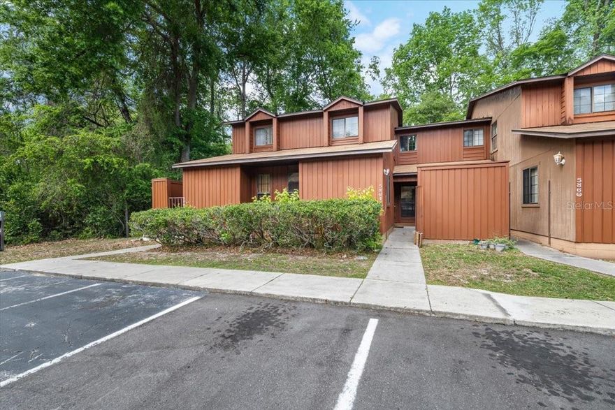 Spacious 3 bedroom / 3 bathroom townhome(NOT A CONDO) featuring a **rare ground-floor bedroom with a full bath**—an ideal setup for multi-generational living or added privacy. Each bedroom has its own dedicated bathroom, and this particular unit sits near the end of the row, offering a more private setting with fewer neighbors. The floor plan includes three generously sized bedrooms, three full baths, an open living and dining area, and an expanded screened porch that seamlessly extends your living space. Durable tile downstairs and laminate flooring upstairs - NO CARPET! You’ll also enjoy a separate laundry and storage room. The screened porch overlooks peaceful greenspace, giving you a quiet, natural backdrop to relax and unwind. Rockwood Villas offers low-maintenance living with excellent amenities, including two pools, tennis, basketball, and volleyball courts. The HOA covers exterior maintenance, lawn care, pest control, and more. All of this is just minutes from UF, Santa Fe College, Shands, North Florida Regional, Oaks Mall, Butler Plaza, Celebration Pointe, and I-75. This is a townhome(single-family attached home) not a condo, so there are plenty of great financing opportunities with little money down! Come see why Rockwood Villas is such a beloved community! Priced to SELL!