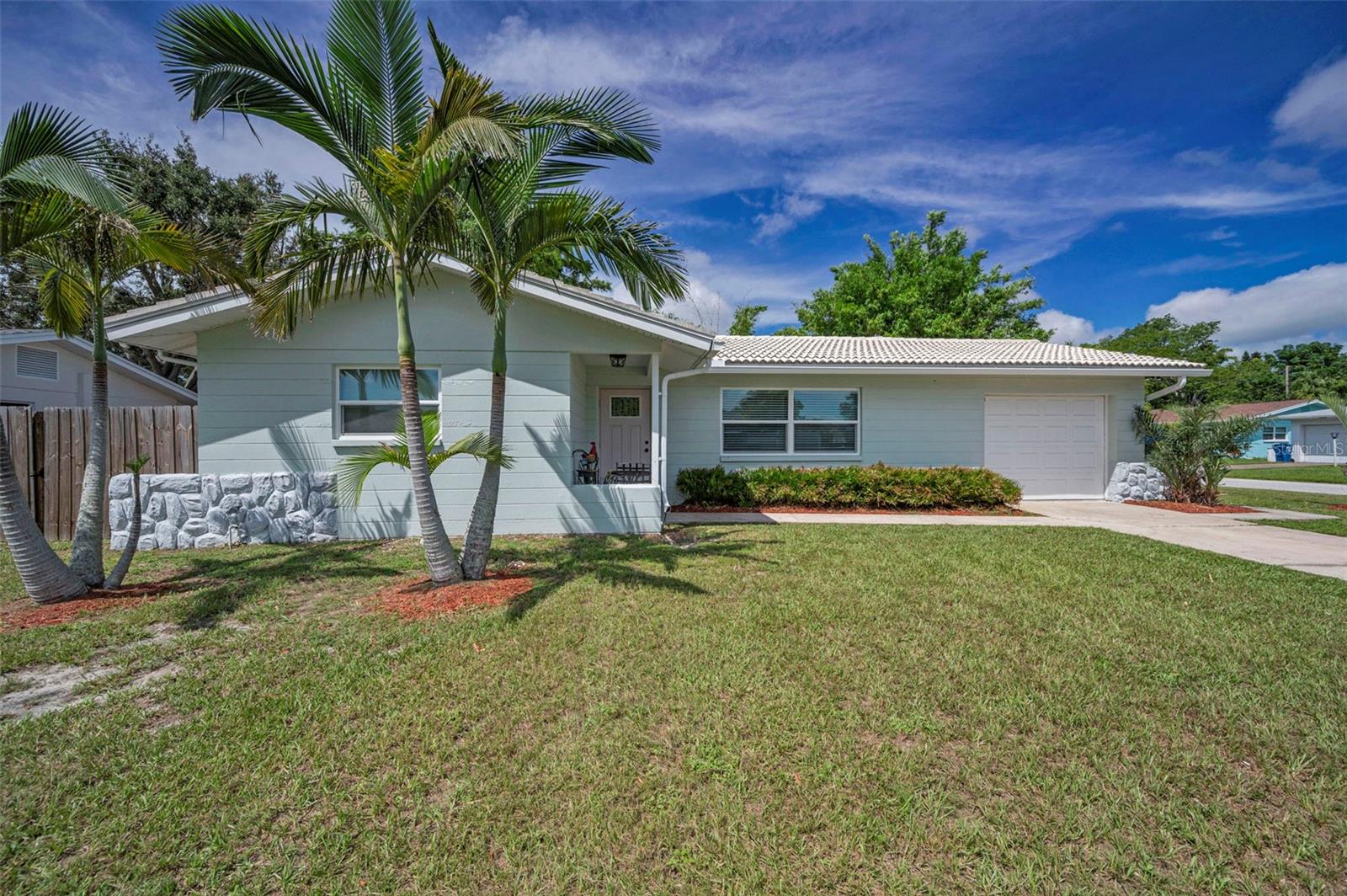 Beautiful updated Seminole home located in a wonderful neighborhood. No flood insurance required and no damage whatsoever from both storms. Two bedrooms, two bathrooms, 1,138sf. of living, and a one car garage. Open floor plan with living room, dining room, and rear Florida room. Exceptional home so well maintained. Some of the many updates: New kitchen and bathrooms in 2024, New thermal windows throughout in 2024, New A/C 2024, New hot water heater 2023, Exterior painted in 2024, new fencing 2025, new exterior doors 2024, and new A/C ductwork in 2013. Large corner fenced in lot with rear screened in lanai overlooking an incredible backyard loaded with privacy. Exceptional overall location close to the Gulf Beaches, shopping, and dining. Be sure to view the beautiful virtual tour.