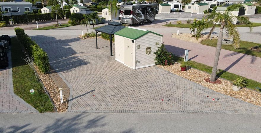 This beautiful brick pavered PULL-THRU RV lot is located within the Elite Resorts at Citrus Valley RV Park, just 8 miles from Disney World and close to shopping and restaurants in beautiful Clermont FL. This particular lot is a full PULL-THRU lot, 2934sf in total size, with the length being about 84.5ft on either side and 40.41ft across the ends. As for location, it doesn't get any better! This lot is located directly across from the Office/Clubhouse/Pool area. Wow!

Included on the lot is approx. 2000sf of pavers, 10x12 shed with electric. Also included is a hard covered gazebo (10x12), plus beautiful landscaping.

Citrus Valley is a gated RV Land Condominium community of 305 privately owned lots, welcoming RV and Park Model units. Citrus Valley is not a 55+ community, but is deed restricted with a Park Manager to ensure quality standards are met and property values are maximized. Park amenities include Clubhouse/Office, two bath houses, laundry facilities, bingo, Veteran's group, and numerous social events, grass is cut regularly on all lots (provided it is accessible), plus water, sewer, trash, cable TV/Internet are included with your quarterly Condo Association dues. Owners also have the option to rent their lot if they wish (however renting is thru each individual owner and not thru the Park Office/Manager).