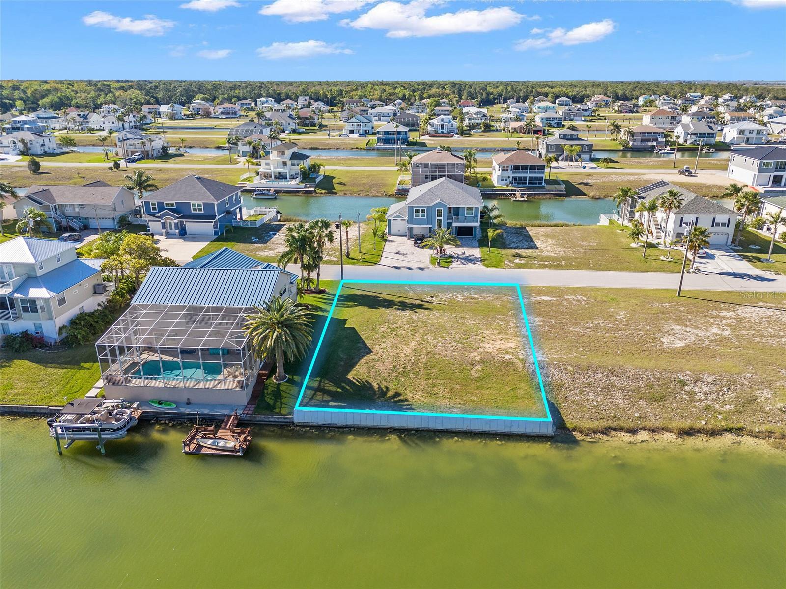 Escape to the serene beauty of Hernando Beach South with this exceptional opportunity to design and build your dream home on a spacious 75 ft x 100 ft lot. Boasting a coveted rear southern exposure, soak up the sun's warmth all day while reveling in the tranquility of this hidden gem nestled within the Weeki Wachee Preserve.
Immerse yourself in a community where modern convenience meets natural splendor. Explore charming local eateries and shops just a stroll away, while nearby Weeki Wachee Springs and the Weeki Wachee River beckon with their breathtaking vistas and recreational opportunities.
For the avid water enthusiast, the modest $306 annual homeowners association fee not only covers lawn maintenance but also provides access to the community boat ramp. Spend weekends exploring the Hernando Beach "Flats" or embarking on scenic boat rides to Anclote or the Homosassa River.
This exceptional lot comes complete with architecture drawings, soil test data, survey data, and a brand-new seawall, offering the perfect foundation to bring your coastal vision to life. Envision the stunning views from your third-story haven, overlooking the preserve and the sparkling Gulf of Mexico.
Don't miss out on the chance to create the coastal lifestyle you've always dreamed of. Seize this opportunity to craft your perfect sanctuary in Hernando Beach South – where every day feels like a vacation.