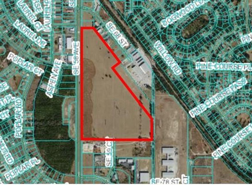 This is an incredible 57.45 Acre industrial and heavy commercial land offering. With Four Lane exposure on SR 35 with water and sewer to site. It has both commercial zoning and PUD industrial zoning that is extremely generous and will tolerate almost any industrial use. City of Belleview water, sewer, fiber, and natural gas. Median cut at Aspen Road on SR 35. Access from SE 59th Ct also.