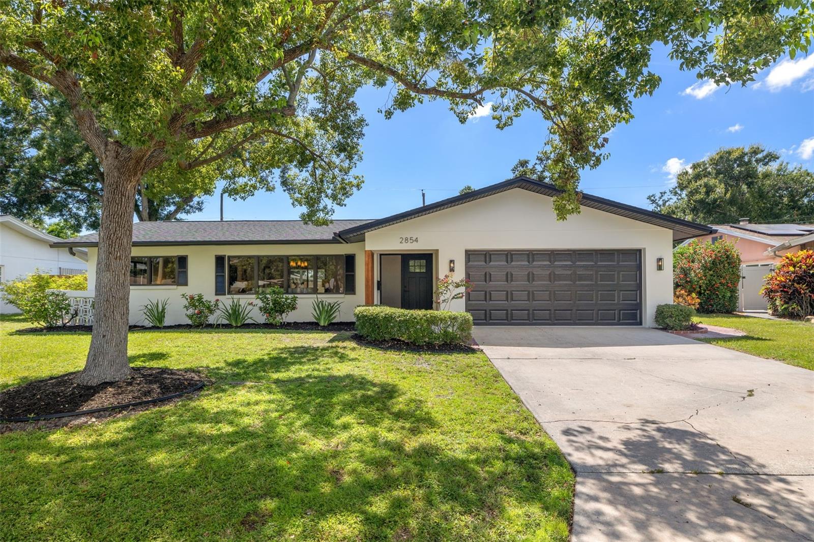 Modern Style Meets Effortless Living in this Scandinavian-Inspired Dream!
Step into a home where thoughtful design meets everyday comfort in this beautifully reimagined 4-bedroom, 3-bathroom retreat. Nestled on nearly a ¼-acre lot in a HIGH AND DRY non-flood zone, this light-filled home delivers over 1,800 square feet of functional elegance — perfect for anyone who craves clean lines, open spaces, and understated luxury.
Inside you’re greeted by engineered hardwood floors that stretch across a spacious open floor plan. The split layout ensures privacy for the primary suite, while expansive windows invite in natural light from every angle.
The chef-worthy kitchen is a standout with brand-new cabinetry, quartz countertops, and high-end appliances—including a versatile quatro-door refrigerator. Whether you're prepping a quiet dinner or entertaining a crowd, this space is as functional as it is beautiful. Not one, not two, but THREE updated bathrooms provide convenience and privacy for everyone in your home.
Effortlessly enjoy the outdoors with this fantastic screened lanai -- imagine cool Florida winter evenings with friends or peaceful mornings with your coffee. The fully fenced backyard offers ample room to create your dream outdoor living area — think pool, garden, fire pit, additional storage--the MASSIVE canvas is waiting for your vision.
Other highlights include:
Brand-new dimensional shingle roof, HVAC, and water heater.
Three full bathrooms—perfect for guests or a growing household, 2-car garage for convenience, workshop and storage.
Located just minutes from shopping, dining, and world-class beaches. Tampa International and Clearwater/St Pete Airports are a short drive away. A short drive to Downtown St Pete, the world class state of the art pier, live music, dining, shopping and arts. Outdoor living is a dream when you're this close to all the outdoor activities, beaches, boating and parks..
Schedule your private showing today and come fall in love!
