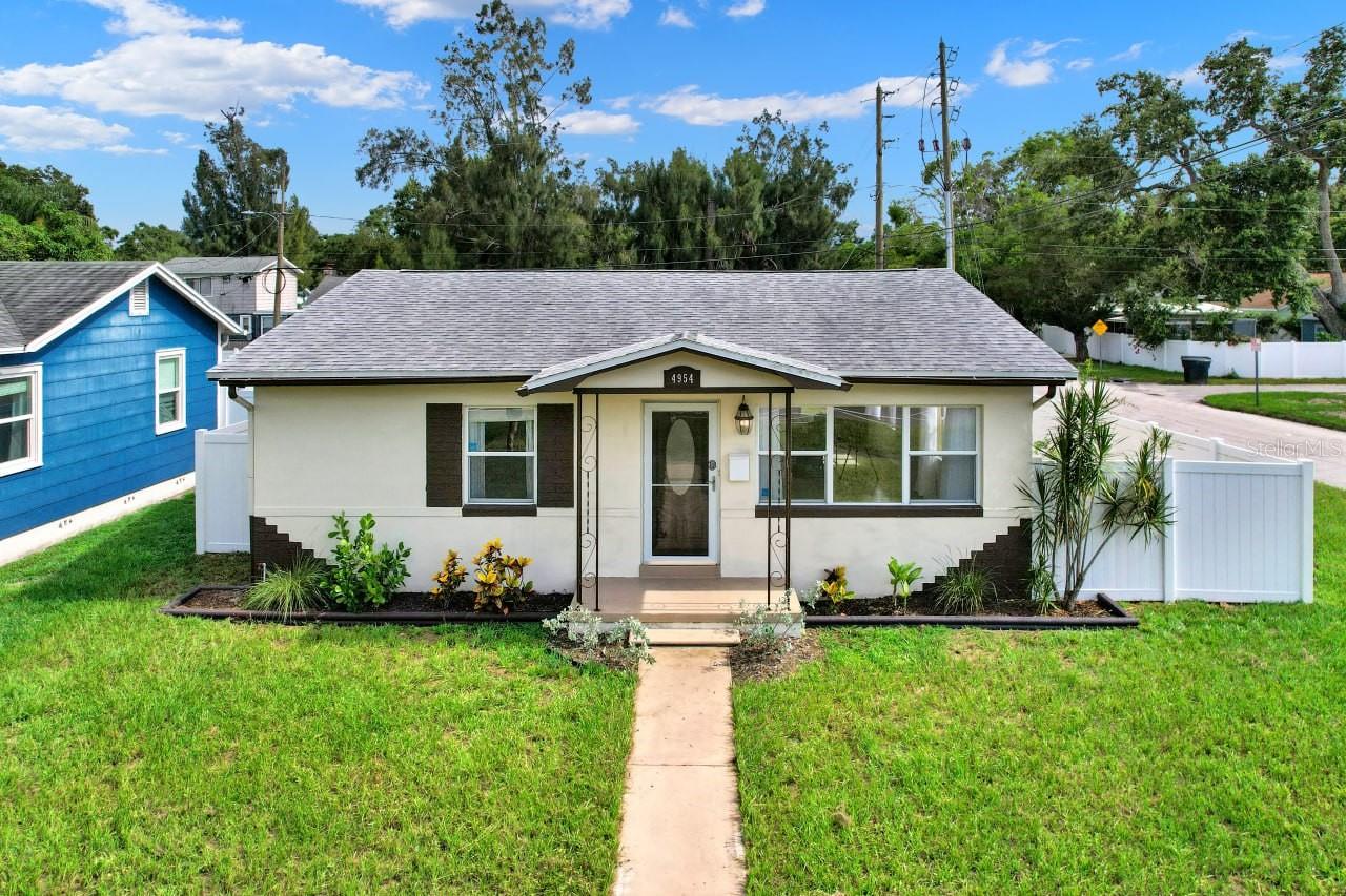 One or more photo(s) has been virtually staged. 2BR/1BA Updated Home on a Corner Lot. Flexible terms available — no bank qualification required. Low or bad credit scores are welcome. A portion of the monthly rent can be applied toward the purchase price for qualified applicants. This beautifully maintained 2-bedroom, 1-bathroom block home is located on a spacious corner lot in the heart of St. Petersburg. It offers the ideal blend of charm and functionality, featuring original terrazzo flooring and a bright, freshly painted interior. The eat-in kitchen includes solid wood cabinetry, stainless steel appliances, and abundant natural light. Both bedrooms are generously sized. Additional highlights include a 1-car garage, carport, central A/C, and recent updates to the roof (2017) and water heater (2017). Enjoy a large yard with mature trees, plus convenient access to downtown St. Pete, Gulfport, public transportation, nearby parks, and the Pinellas Trail.