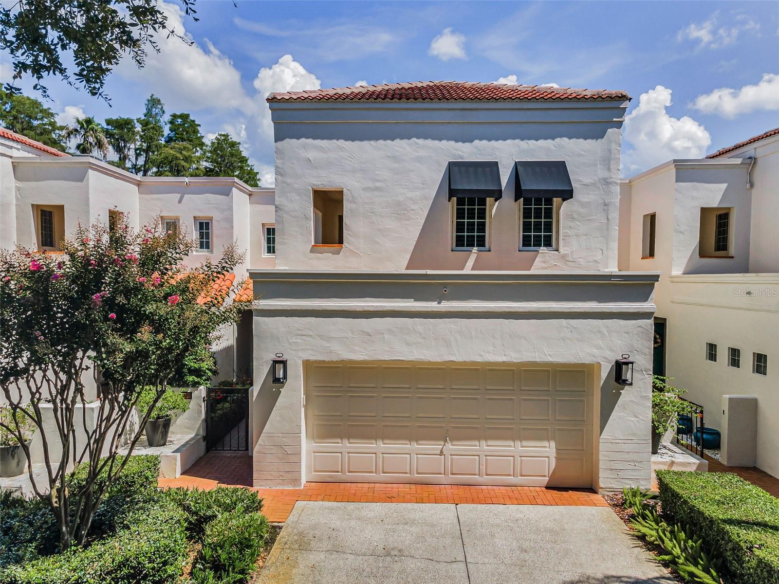 Lake Ellen Landings – Tampa’s Best-Kept Secret. Discover a rare blend of privacy, natural beauty, and convenience in this stunning lakeside townhouse located in the heart of Carrollwood. Tucked away at the end of a quiet, tree-lined street within the exclusive, gated community of Lake Ellen Landings, this home offers breathtaking water views and a central location just minutes from all that Tampa has to offer. This spacious three-bedroom, three-bath residence lives like a single-family home and has been extensively upgraded with no expense spared. The sellers completed a full plunge pool/spa and patio renovation in 2020, featuring elegant travertine pavers, upgraded glass tile pool trim, new pool pump, blower, gas heater, and a saltwater system—creating the ultimate outdoor entertaining area overlooking the serene lake. A private garden entry welcomes you to the custom front door, where soaring ceilings and panoramic lake views immediately capture your attention. Inside, you’ll find a redesigned modern stairwell with sleek cable railing, a whole-house intercom system, plantation shutters on every window, and motorized wireless shades on all sliding door openings. From the thoughtfully curated finishes to the tranquil lakeside setting, this property offers the perfect balance of luxury, comfort, and location—truly a home you must see to appreciate