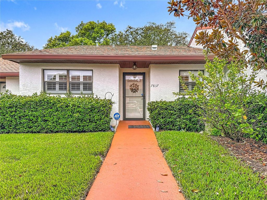 Photo of 7837 Radcliffe Circle #105, Port Richey, FL 34668 (MLS # W7878808)