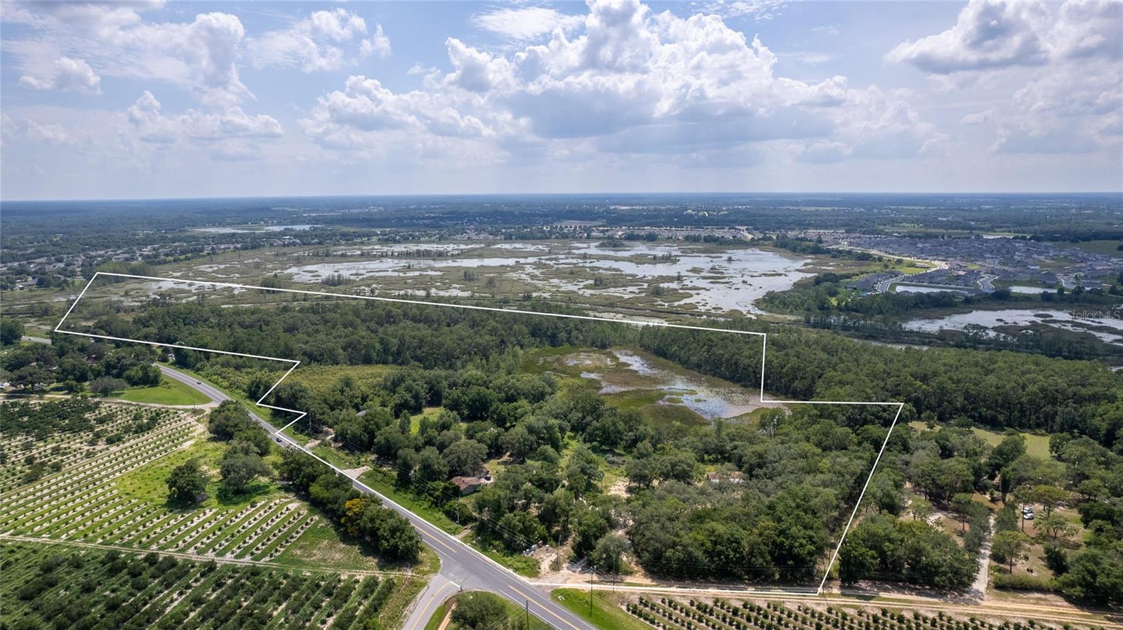 Growth is undeniably coming to Lake County so now is the time to consider how you can best utilize this future commercial retail spot! 58.3 acres of vacant land at the corner of Highway 19 and Cherry Lake Road. Located on the West side of Highway 19 running south, the property features a river that runs along the back of it which leads to Cherry Lake on the Clermont Chain of Lakes. These parcels are currently zoned residential, single family residence or multi-family HOWEVER due to the various subdivisions that are projected nearby, the area’s need for restaurants, banks, a grocery store, drug store or personal services will increase greatly and the County has indicated their preference to make Highway 19 a commercial corridor. A traffic light will be installed at the corner of Cherry Lake Road and Highway 19 in the near future. There are 5 total parcels being sold together that total the 58.3 acres, with approximately 20 acres high and dry. The possibilities for this location are endless, picture a TIKI BAR overlooking the water with a bike path winding along the river; perhaps an open area shopping center with a restaurant on one end and water sports rentals at the other. There is also a boat launch on the parcel. One lot currently has a home on it with a tenant so PLEASE DO NOT DRIVE ONTO OR ENTER PROPERTY WITHOUT PRIOR APPROVAL. Utilities are at the street which include water, electric and sewer.