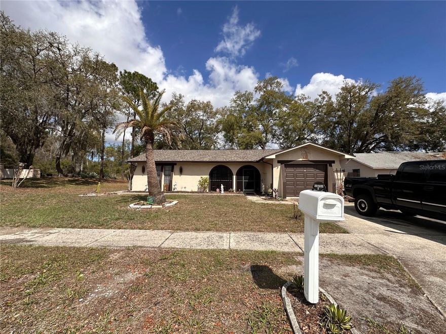 Welcome to this charming 2-bedroom, 2-bathroom home in Hudson, FL, offering 1,026 square feet of comfortable living space on a desirable corner lot with no HOA! Located in a quiet, established neighborhood in Hudson, this property is perfect for first-time homebuyers, downsizers, or investors looking for a great opportunity on Florida’s Gulf Coast.

Step inside to a bright, open-concept living and dining area filled with natural light, creating an inviting space for relaxing or entertaining. The functional kitchen features ample cabinet storage and workspace, ideal for everyday cooking and convenience.

The primary suite includes a private en-suite bathroom, while the second bedroom and full bath provide flexibility for guests, a home office, or additional living space.

Enjoy the benefits of a spacious corner lot, offering extra yard space, added privacy, and room for outdoor living, gardening, or even future upgrades. With no HOA restrictions, you have the freedom to personalize your property without added fees or limitations.

Location Highlights:
Minutes to Hudson Beach and Gulf Coast waterfront parks
Close to shopping, restaurants, and everyday conveniences
Easy access to US-19 for commuting to surrounding areas
Short drive to Port Richey and New Port Richey
Whether you're searching for a starter home in Hudson, FL, a low-maintenance Florida property, or an investment opportunity with no HOA, this home checks all the boxes.