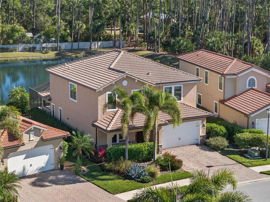 Gated community of Calusa Park! Beautiful 4 bedroom plus office, 3 bath, 2-car garage waterfront pool home minutes from Legacy Trail and a quick drive to Nokomis Beach! Step inside to a spacious two-story residence featuring 3,164 sf of living space, high ceilings, elegant lighting, neutral décor and tile flooring in main living areas. Main floor features French doors to office, open kitchen and great room with triple slider to lanai plus bedroom and full bath. Well equipped kitchen offers granite countertops, stainless appliances, large center island with breakfast bar and an amazing Butler’s pantry plus walk-in pantry. Second floor features generous primary suite with attached sitting area, private bath with dual vanities, garden bath and walk-in shower plus fully custom walk-in-closet which conveniently opens to laundry room. You will also find two additional bedrooms, full bath and family/media room area on the second floor. Outdoor entertaining area features covered lanai, pavers, hook-ups for outdoor kitchen and panoramic screened saltwater pool and spa with unobstructed water views and eastern exposure to enjoy gorgeous sunrises. Additional features include hurricane impact windows, covered front entrance, extra room off garage - a great space for second refrigerator/freezer or wine cooler, irrigation system and lushly landscaped exterior for impeccable curb appeal.  Calusa Park amenities include community pool plus, complete lawn maintenance in the low HOA fee. Quiet serene setting to enjoy nature in a great location close to restaurants, shopping, schools, beautiful parks and a short drive to Gulf Beaches. Don’t miss the opportunity to make this your dream home! Schedule your private showing today!