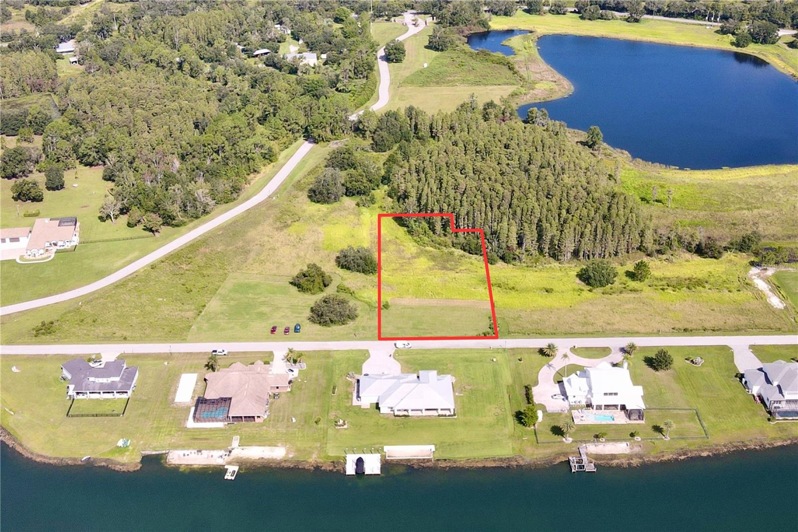 Outlaw Ridge offers seven spacious residential lots ranging from 1 to 1.88 acres, nestled within a private, gated community designed for custom-built homes. Located in a quiet and scenic setting, the community offers a peaceful atmosphere surrounded by nature
and is ideal for those seeking a quiet lifestyle.
The available lots include a mix of wetlands and floodplain areas. Many of the sites back up to wooded areas or designated conservation land, offering serene views and privacy. Utilities are well and septic.
The lots are located within Outlaw Ridge, a gated community, on Outlaw Way and Hideout Trail in Land O' Lakes in Pasco County. Outlaw Ridge is situated on Ehren Cutoff. Ehren Cutoff connects US 41 to State Road 52.
The site is approximately 10 minutes from US Highway 41, where nearby medical shopping, and schools are located. Additionally, it's 1.6 miles from State Road 52, 5.9 miles from I-75, and 7.6 miles from the Suncoast Parkway. The area offers a mix of rural and urban surroundings. Due to its proximity to major thoroughfares, it's just a short commute from Wesley Chapel (20 minutes), Dade City (25 minutes), Brooksville (30 minutes), New Port Richey (40 minutes), Tampa International Airport (40 minutes), downtown Tampa (40 minutes), and downtown St. Petersburg (50 minutes).