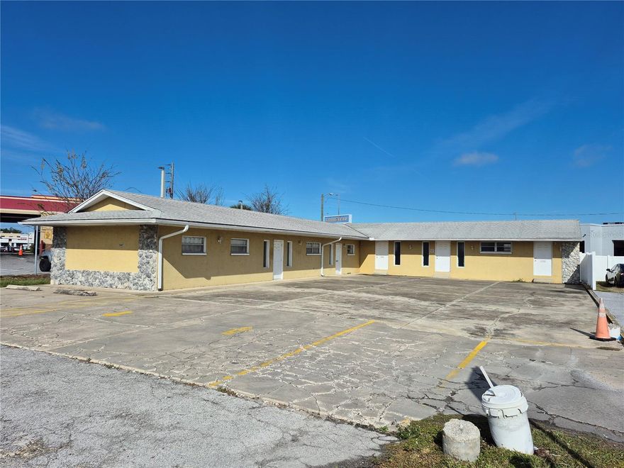 One or more photo(s) has been virtually staged. Great Commercial Property With High Visibility From US Highway 19

This easy to see commercial property, located  on Marine Parkway just off of US Hwy 19, offers exceptional exposure and accessibility in a thriving business corridor. Situated within the Highway Commercial Zoning District, the site can fulfill a wide range of permitted uses, including retail, professional office, medical or personal services, schools or training centers, brewery or taproom, cannabis dispensary, and more—making it ideal for both investors and owner-users. The West wing of the structure (closest to Marine Pkwy) is at grade level and the North wing (furthest from Marine Pkwy) is approximately a foot above grade.

The property is located in close proximity to multiple ongoing and future developments that will be increasing an already very high traffic flow as well as local demand.  Across US 19 from the property 96 new luxury condo units are being constructed with plans for a 92 Unit High Rise Hotel.  Right down Marine Parkway just east will be a planned rental community bringing 473 units consisting of single family townhomes and apartment buildings.  There are multiple housing projects being built or planned within minutes and integrating with the developing New Port Richey Downtown area. This property is ready for the right visionary who can see where the area is going and knows how to be a part of the future.

The property is divided into two buildings sharing a common wall that can function as up to four separate units, featuring four restrooms and five exterior access doors. This flexible configuration allows you to occupy one space and lease the remaining units, or lease the entire property for maximum income potential.

Whether you’re expanding a business, launching a new concept, or seeking a versatile investment property, this site delivers outstanding visibility, adaptable space, and strong zoning advantages.