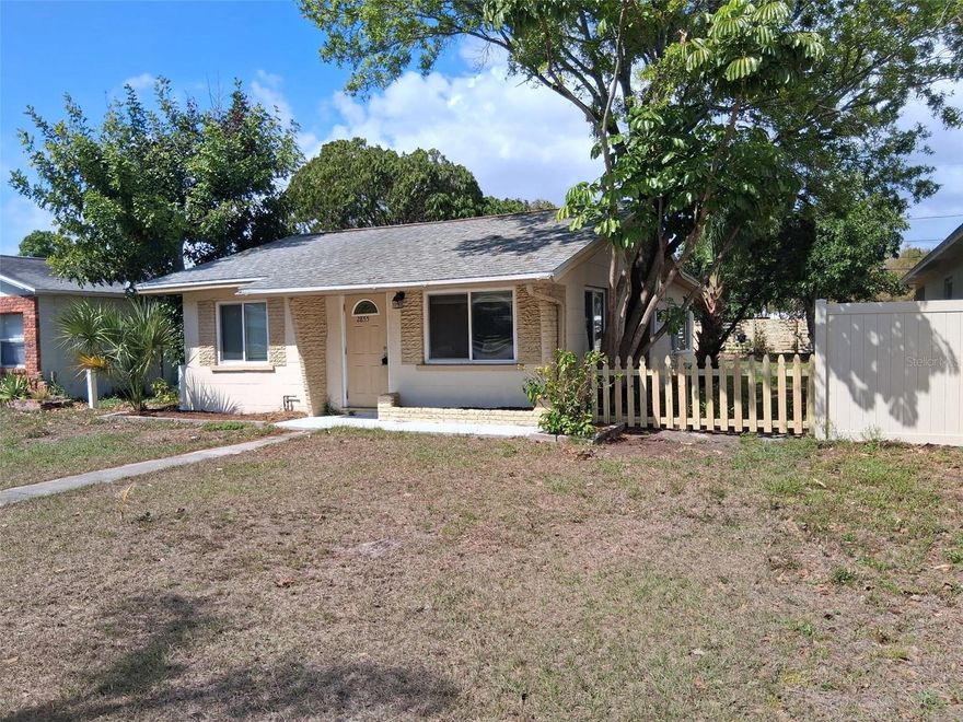 Renovated two bedroom one bath non-flood zone block home.  Newer roof, AC, and windows. Quiet safe neighborhood close to shopping and downtown St. Petersburg, and easy access to I-275.  The kitchen has granite countertops and stainless-steel appliances including glass top stove and disposal.  Ceiling fans.  Vinyl engineered flooring.  Large utility/laundry storage room Oversize carport with room for multiple vehicles in alley accessed driveway. Come and look!