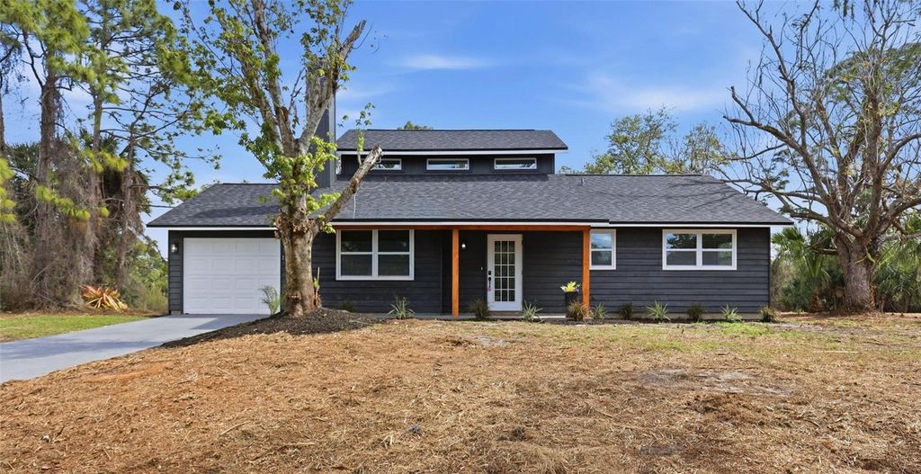 Photo of 1600 Tile Terrace, North Port, FL 34286 (MLS # O6389480)