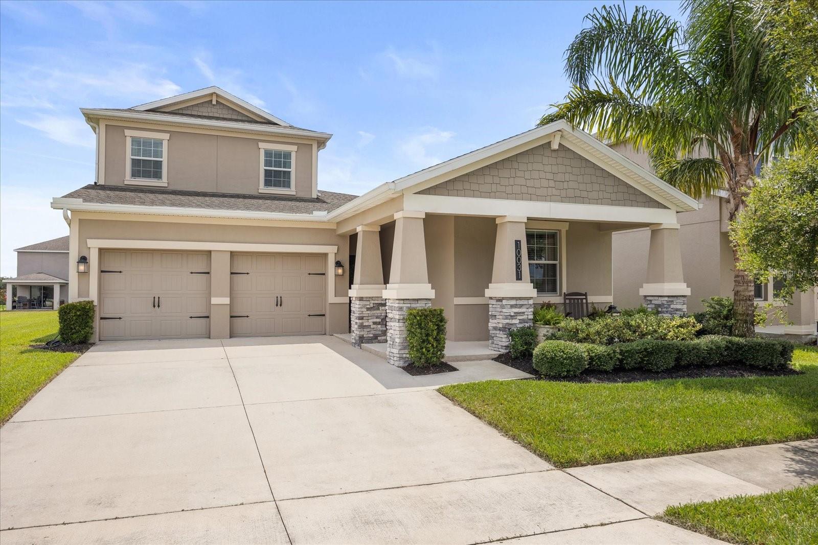 Welcome to 10031 Bedtime Story Drive—where comfort, convenience, and community come together in one incredible home. Perfectly positioned on a premium corner lot in the sought-after Storey Grove neighborhood, this spacious 4-bedroom, 4-bathroom residence offers over 2,700 square feet of upgraded living space on a generous quarter-acre lot with a 2-car garage. Inside, you’ll find fresh updates throughout, including brand-new carpet and padding, new ceiling fans, modern pendant lighting in the kitchen, updated door hardware, and a fresh coat of paint that gives the home a like-new feel. The open-concept layout flows seamlessly from the chef-style kitchen—now featuring freshly refinished upper cabinets paired with gray lowers, stainless steel appliances, and a sliding door has been added to the pantry for improved space and style—to the inviting living and dining areas with crown molding, ideal for entertaining or relaxing. The bathrooms have also been upgraded with new fixtures and striking navy blue cabinetry for a modern, designer look. Closet organizers were installed in both the primary suite and one of the downstairs bedrooms for added function. One of the standout features is the enclosed upstairs loft with its own full bathroom, added closet, making it perfect as a mother-in-law suite, second master bedroom, game room, or fifth bedroom. The primary suite on the main level offers a spacious walk-in closet and a spa-inspired bathroom. Step outside to a covered patio and enjoy private backyard views, where you can even watch Disney fireworks and rocket launches in the distance. Additional highlights include a dedicated laundry room, security system, thermal windows, pest control service, and lawn care included with the HOA. Storey Grove offers residents access to top-rated schools, including Horizon High School and Water Springs K–8, along with an impressive list of community amenities such as a clubhouse, fitness center, dog park, playground, resort-style pool, tennis courts, and beautifully maintained parks and trails. This home blends thoughtful upgrades, a flexible layout, and a prime location—making it the perfect fit for families or those seeking multigenerational living. Don’t miss your chance to tour this exceptional Winter Garden property. Schedule your showing today.