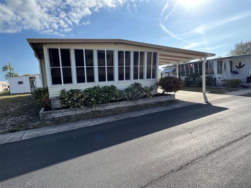 Now available in the highly sought-after 55+ community of Palm Hill Country Club, this fixer-upper presents a wonderful opportunity to create the home you’ve always envisioned while enjoying an active and thriving lifestyle. The community is well known for its welcoming atmosphere and impressive selection of amenities designed for residents to stay social and engaged. A full calendar of planned activities keeps neighbors connected, while recreational options abound with three sparkling pools, shuffleboard courts, tennis courts, and the ever-popular pickleball and much, much more! Residents also appreciate the reasonable monthly maintenance fee of just $554, which conveniently includes water, sewer, lawn care, garbage service, cable, and internet. The location is another outstanding feature, with the scenic Pinellas Trail nearby for walking or biking, along with a wide variety of shopping destinations and restaurants just minutes away. Several of the area’s beautiful Gulf Coast beaches are also within a short drive, making this centrally located community an ideal place to enjoy the Florida lifestyle.
INTERIOR:
This two-bedroom, one-and-a-half bath home offers more living space than expected, thanks to the roomy front Florida room featuring newer windows that brighten the area and create a welcoming first impression. This versatile space provides plenty of room for a sitting area, hobby space, office setup, or additional entertaining area. The kitchen comes equipped with a refrigerator, stove, and dishwasher, along with extra counter space that makes cooking and meal preparation convenient. Just off the kitchen is a comfortable dining area, perfectly positioned for everyday meals or casual gatherings. The sizable living room provides a relaxing place to unwind and includes newer furniture and ceiling fans for added comfort. Carpet runs through much of the home, while the kitchen and bathrooms feature easy-care vinyl flooring. The guest bedroom is generously sized and large enough to accommodate a king-sized bed, and the nearby bathroom offers a long vanity along with a newer shower and tub surround. The primary bedroom also fits a king-sized bed and includes a walk-in closet and an en suite half bath, with additional space available should a future owner wish to expand and install a full walk-in shower if desired. This home is being sold fully furnished for added convenience and includes central heat and air, although the system is currently not working.
EXTERIOR:
From the moment you arrive, this home offers neat and clean curb appeal with attractive vinyl siding that provides both durability and low maintenance. A brand-new roof over installed in 2026 covers the entire home as well as the Florida room, offering valuable protection and peace of mind for years to come. The long carport provides ample covered parking, with a portion recently replaced in 2025, adding to the home's well-maintained exterior features. Just beyond the carport is a convenient shed that houses the washer and dryer while also allowing extra room for storage. This property is priced exceptionally low at only $49,900, which includes the share, making it a wonderful opportunity for buyers looking to add their own updates and improvements. With its solid features and appealing price point, this home is sure to attract attention—so don’t ponder too long, as opportunities like this tend to sell quickly!