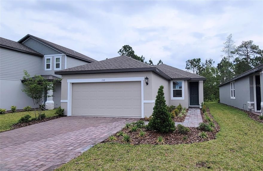 Very nice 3 yr old Energy-Efficient home backs conservation area with relaxing views. This lovely 3-bedroom 2 bath home is in Links Terrace. The Driveway and walkway to front door are all pavers along with the covered patio in back for a more luxury
feel. The inside main living area is an open concept with kitchen/dining open to the living room, so you are never far from the action or
entertainment. The kitchen has gorgeous light grey granite counters, tall wall cabinets with crown molding, and large island kitchen for breakfast bar. Plenty of counter and cabinet space with a side pantry closet for more storage. Energy efficient, stainless-steel appliances include fridge, stove, microwave, dishwasher. Ceramic tiles throughout for ease of use and cleaning, except carpets in bedroom for comfort. Large Primary bedroom is split away from the other bedrooms providing a little more privacy. The bathroom has dual vanity with beautiful luxury granite, large shower stall, separate toilet room and huge walk-in closet. On the opposite side of the home are the other two bedrooms, Side bath, linen closet, and laundry room. The home has tall ceilings throughout and 2 inch wood faux blinds over all Energy efficient windows and ceiling fans in each bedroom. The tall back slider door opens to a covered patio and yard with great natural Florida views. Links Terrace is a great community in the famed LGPA International master planned community. This community has a nice playground and is wrapped around a few ponds to enjoy the nature. Though it does not have a pool inside this community, it is right next to the LGPA clubhouse and Pool. You have the option to join for an extra fee to be able to use their facilities and incredible pool. Links Terrace and LGPA is nestled on the west side of WorldFamous Daytona Beach, between the I4 and 95. With winding, tree covered roads and close proximity to schools, tons of new shops and restaurants and the International Daytona Beach Airport and Speedway, this is truly a gem to make your own. Meritage® homes are designed with innovative and energy-efficiency in mind. Make this your home today. Please email for more information.