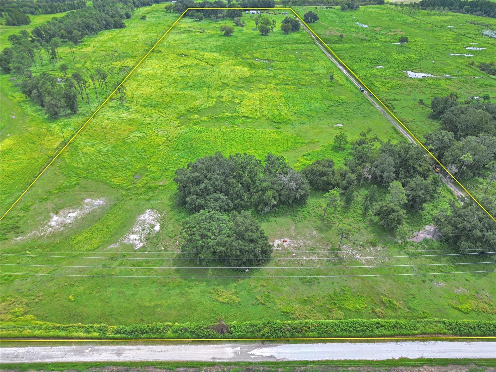 40.20 Acres – Polk County Working Ranch & Homestead This high and dry 40.20-acre spread is a rare find for anyone dreaming of a true working ranch or private homestead. From equestrian training to multi-species livestock, this property is set up and ready to grow with you. -Equine facilities include a well-built 30 ft wooden round pen, a 3-stall horse barn, and heavy-duty arena panels to create a riding or training arena as large or small as you need. -Livestock-ready pastures perfect for horses, cattle, sheep, or goats—plus established fowl runs, hoop coops, and even a dedicated chicken cleaning station for serious poultry keepers. -Private homesite tucked away at the back of the property with a manufactured home, accessed by your own driveway for peace and seclusion. - Wide-open potential—plenty of room for expanding your operation, gardening, or simply enjoying the quiet country lifestyle. Whether you’re a working homesteader, equestrian, or rancher, this Polk County property offers the ideal blend of function, space, and privacy to make your dream a reality.
