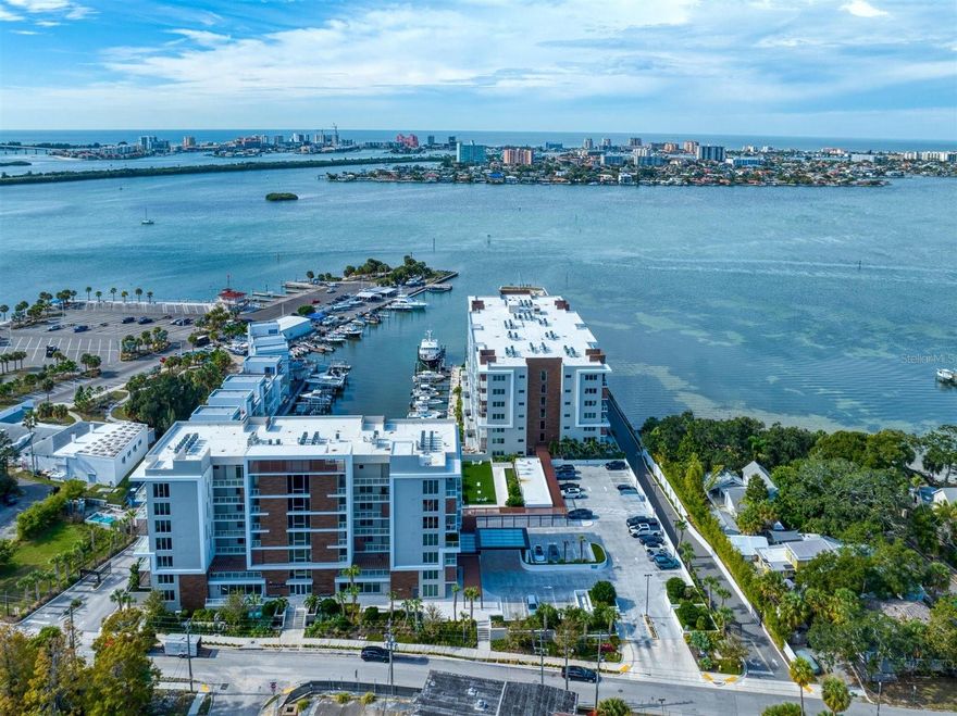 Luxury Redefined at Marina Bay - Experience the pinnacle of waterfront living in this exquisite, single-owner corner residence. Occupied for only three months, this home presents as a brand-new masterpiece, offering the rare advantage of being sold fully furnished with Restoration Hardware collections. As a coveted end unit, the floor plan is bathed in natural light from three sides, showcasing panoramic water views through expansive windows and two private balcony —perfect for enjoying Clearwater’s legendary sunsets. No detail has been overlooked in this 3-bedroom, 2-bathroom sanctuary. The interior features a designer palette of Farrow & Ball paint, while the spa-style bathrooms are upgraded with Toto touchless toilets and washlets. The chef’s kitchen is an entertainer’s dream with high-end appliances and a stone-clad island, complemented by a newer Samsung laundry suite and private storage.
Living at Marina Bay means embracing a 24/7 resort lifestyle. Enjoy world-class amenities including a full-service concierge, heated pool and spa, fitness center, sauna, and putting green. For boaters, the on-site marina offers leasable slips just steps from your door. Located in the heart of Downtown Clearwater, you are within a short distance of the newly developed Coachman Park and The Sound Amphitheater, and only minutes from the nation’s top-rated beaches. This isn't just a home; it is a meticulously curated lifestyle waiting for its next owner.