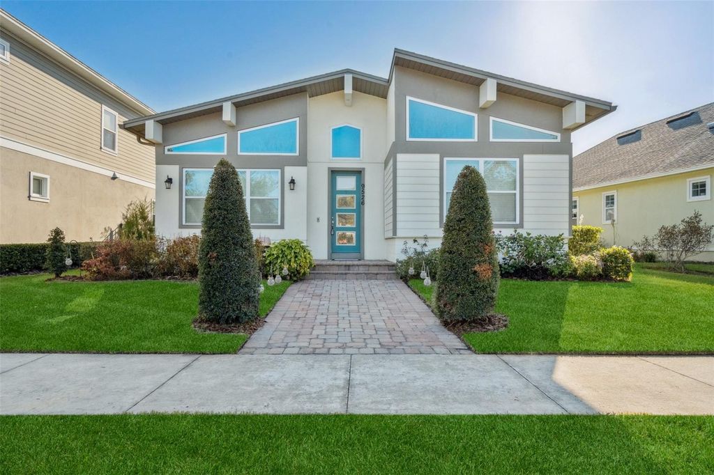 Photo of 9526 Tavistock Lakes Boulevard, Orlando, FL 32827 (MLS # O6364140)