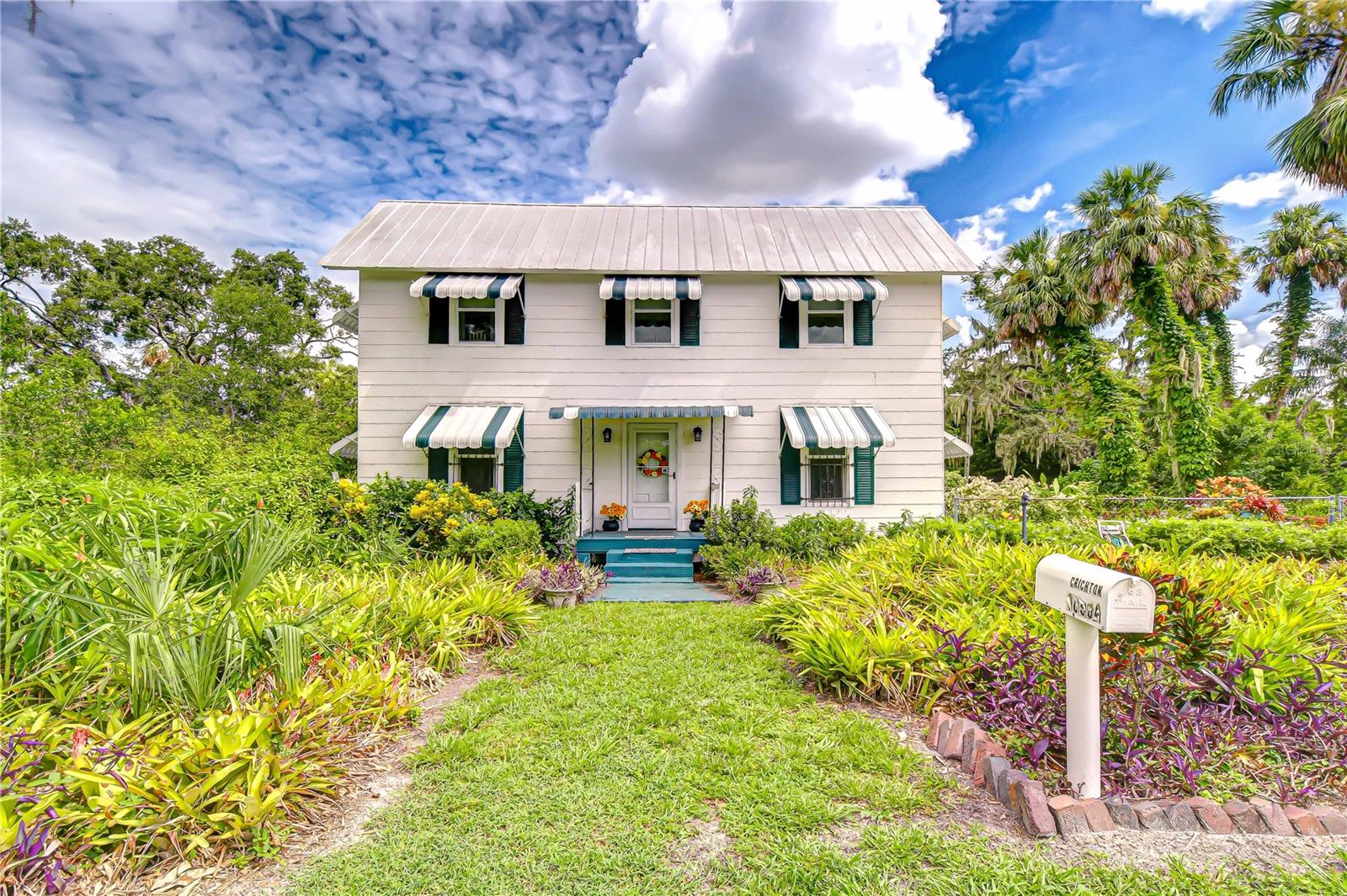 Get ready to fall in love with these 6 acres of history, charm & endless possibilities in the heart of Riverview. Spanning 6 acres of picturesque land, this unique property offers an extraordinary combination of history, charm, and versatility. With ASC-1 zoning (Agricultural, Single-Family, 1 Acre Minimum), the possibilities are endless—you can enjoy a private estate, create a multi-generational homestead, raise horses or small livestock, or run certain home-based businesses while maintaining the property’s residential character. The acreage, dual access points, and two on-site utility poles open the door for ventures like a charming tea room, a workshop, an Airbnb retreat, or simply preserving it as a rare and peaceful slice of Riverview’s past. Recent updates ensure both charm and peace of mind: metal roof replaced in 2011 with Galvalume metal and hurricane strapping, flat roof added in 2025 with a 25-year warranty, upgraded AC mini-splits upstairs (2017), new downstairs AC unit (2023) with a 12-year warranty, electrical panel box replaced in 2019, and a Rheem water heater installed in 2021.If the stunning grandfather oaks could talk, they’d share captivating stories from Riverview’s early days, when the area was a bustling hub for pine milling. Today, the same location is just minutes from vibrant restaurants, top-rated schools, and world-class medical facilities, offering the perfect blend of country living and city convenience. Built in 1910 by master carpenter James L. Hackney as his personal residence, the home was crafted to stand the test of time—no shortcuts taken. When it changed hands in 1952, its new owner, an employee of GE, infused it with the latest modern conveniences of the era. Inside, you’ll find five bedrooms, including the primary suite on the main floor, a spacious great room, and a large Florida sunroom just off the kitchen—perfect for gathering with family and friends. Step outside to explore the naturally manicured grounds, bursting with tropical flowers, and take a peaceful stroll around the backyard pond, where Mother Nature displays her most beautiful, untouched side. Opportunities like this are rare. Here’s your chance to own not just a home, but a remarkable piece of Riverview’s history. Conveniently located north of the Alafia River, this property is just 10 minutes from a boat ramp on the river and offers easy access to the Crosstown Expressway and I-75 entrance ramp. Situated just past Bloomingdale on US-301, you’ll enjoy both peaceful country living and quick connectivity to everything Riverview and the surrounding area have to offer.