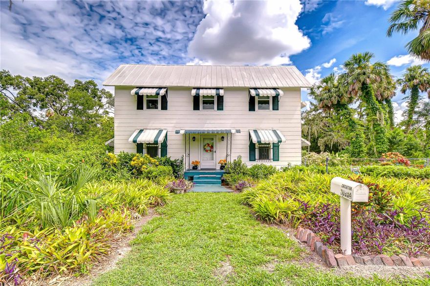 Get ready to fall in love with these 6 acres of history, charm & endless possibilities in the heart of Riverview. Spanning 6 acres of picturesque land, this unique property offers an extraordinary combination of history, charm, and versatility. With ASC-1 zoning (Agricultural, Single-Family, 1 Acre Minimum), the possibilities are endless—you can enjoy a private estate, create a multi-generational homestead, raise horses or small livestock, or run certain home-based businesses while maintaining the property’s residential character. The acreage, dual access points, and two on-site utility poles open the door for ventures like a charming tea room, a workshop, an Airbnb retreat, or simply preserving it as a rare and peaceful slice of Riverview’s past. Recent updates ensure both charm and peace of mind: metal roof replaced in 2011 with Galvalume metal and hurricane strapping, flat roof added in 2025 with a 25-year warranty, upgraded AC mini-splits upstairs (2017), new downstairs AC unit (2023) with a 12-year warranty, electrical panel box replaced in 2019, and a Rheem water heater installed in 2021.If the stunning grandfather oaks could talk, they’d share captivating stories from Riverview’s early days, when the area was a bustling hub for pine milling. Today, the same location is just minutes from vibrant restaurants, top-rated schools, and world-class medical facilities, offering the perfect blend of country living and city convenience. Built in 1910 by master carpenter James L. Hackney as his personal residence, the home was crafted to stand the test of time—no shortcuts taken. When it changed hands in 1952, its new owner, an employee of GE, infused it with the latest modern conveniences of the era. Inside, you’ll find five bedrooms, including the primary suite on the main floor, a spacious great room, and a large Florida sunroom just off the kitchen—perfect for gathering with family and friends. Step outside to explore the naturally manicured grounds, bursting with tropical flowers, and take a peaceful stroll around the backyard pond, where Mother Nature displays her most beautiful, untouched side. Opportunities like this are rare. Here’s your chance to own not just a home, but a remarkable piece of Riverview’s history. Conveniently located north of the Alafia River, this property is just 10 minutes from a boat ramp on the river and offers easy access to the Crosstown Expressway and I-75 entrance ramp. Situated just past Bloomingdale on US-301, you’ll enjoy both peaceful country living and quick connectivity to everything Riverview and the surrounding area have to offer.