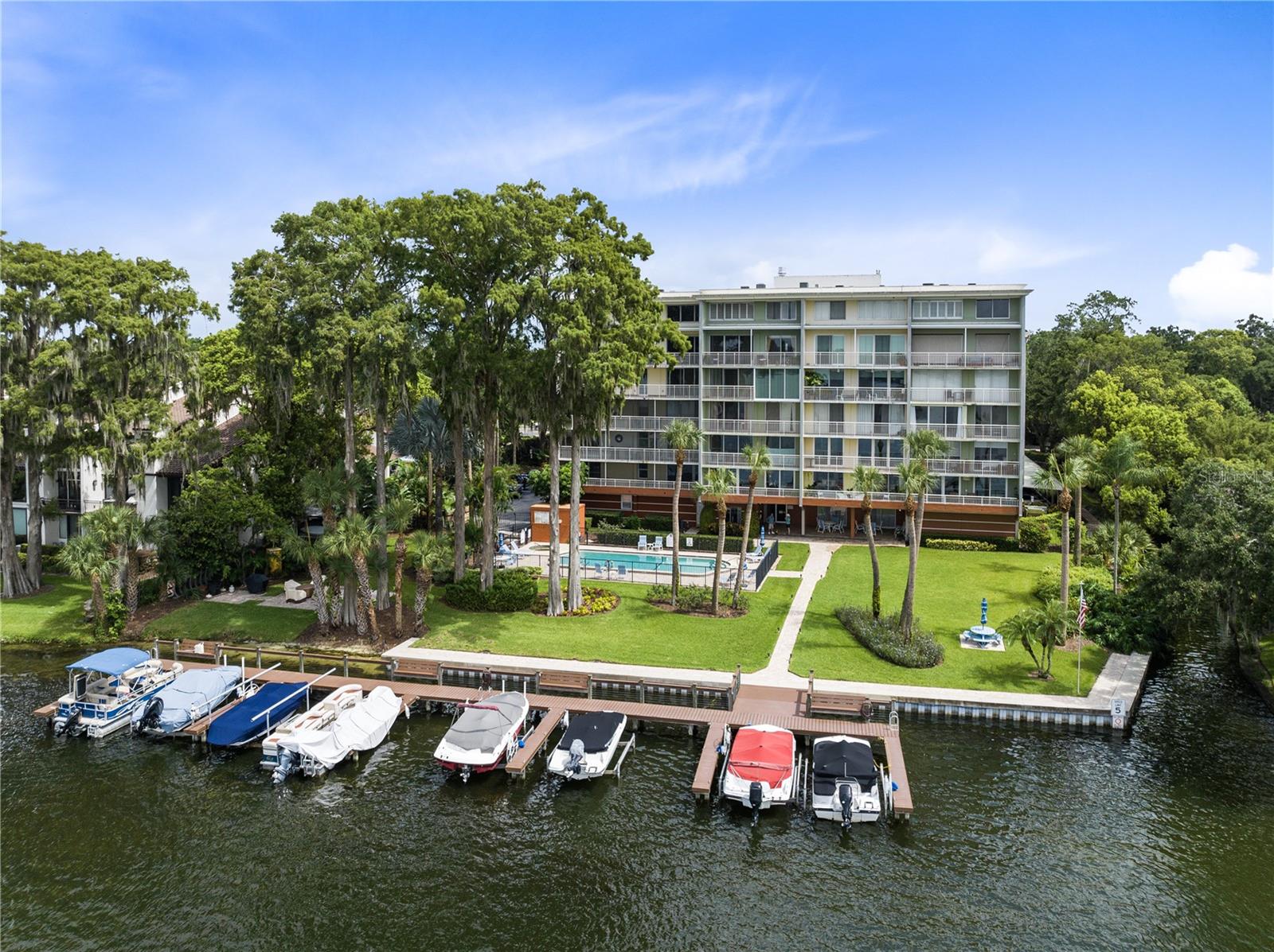 Welcome to breathtaking waterfront living at Lake Virginia Condo community in Winter Park. Gorgeous water views from every room in this fourth floor, 915 sqft, 1-bedroom, 1.5-bathroom end unit overlooking Lake Virginia and the Lake Virginia-Osceola Canal. Step inside and immediately you’re greeted by Lake Virginia through the large floor to ceiling sliders. The roomy bedroom and bathroom provide comfort and convenience, while a private balcony off the master bedroom invites you to unwind by the water. The L-shaped kitchen is large enough to cook and entertain, featuring new appliances and ample counter space. It overlooks the generously sized living room, creating a seamless flow for hosting guests or simply relaxing with loved ones. Large sliders in the living room showcase stunning vistas of Lake Virginia, filling the space with natural light and a sense of tranquility. As part of the Lake Virginia Condo community, residents enjoy an array of outstanding amenities. Covered parking ensures convenience and protection for your vehicle, and the secure lobby offers peace of mind and security. Take advantage of the inviting pool to cool off on warm days or unwind in the fitness center to stay active and healthy. For water enthusiasts, the community provides boat slips (subject to availability, check with HOA) and lake access to the Winter Park Chain of Lakes, perfect for boating, kayaking, and enjoying the water’s beauty. A recreation room offers an ideal setting for social gatherings and events. Beyond the splendor of the community, this condo’s location is truly unbeatable. Only a short walk away, you’ll find yourself in the vibrant Park Avenue shopping and restaurant district, filled with charming boutiques, cafes, and fine dining. Hannibal Square adds to the cultural appeal with its artistic and historical charm. Additionally, the condo’s proximity to major thoroughfares ensures easy commuting and accessibility to various destinations throughout the area. Don’t miss this rare opportunity to own a piece of waterfront paradise in a sought-after community on the Winter Park Chain of Lakes. Experience the allure of lakeside living and embrace the convenience of a vibrant neighborhood. Schedule your viewing today and prepare to fall in love with this exceptional condo at Lake Virginia!