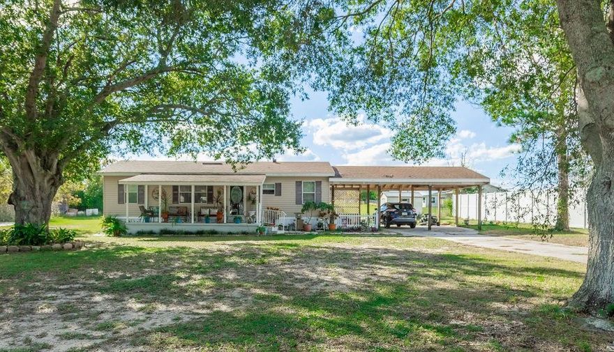 This cozy three-bedroom home on nearly an acre of high dry land offers a spacious front porch shaded by majestic oak trees in a nice country atmosphere yet close to shopping, restaurants and medical needs.  Attached to the home is a well-built double carport with space to hangout or have family/friend gatherings.  There is also a nice shed for storage and shop space.  Located just minutes from downtown Lake Wales with its many festivals and festivities around Lake Wailes or in the beautifully restored streets and parks.  Conveniently located an hour from Orlando and Tampa airports and a little further to either of Florida's gorgeous coasts.  You don't want to miss this one...call today to schedule a viewing appointment.