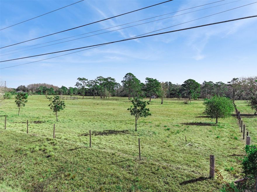 Welcome to an exceptional opportunity in the highly desirable Wedgefield community. This 4.77-acre build-ready property offers the perfect blend of privacy, flexibility, and long-term value. The lot has already been subdivided into two parcels, giving you the rare option to build two separate homes — ideal for multigenerational living, an investment strategy, or creating a private compound. This property is completely high and dry with no wetlands, fully cleared, and entirely fenced in, making it ready for immediate development. A survey and county wetland report have already been completed, saving you time and providing peace of mind. With 331 feet of road frontage, you’ll enjoy a grand entrance and excellent access. Even better? The land directly in front of the property is protected conservation land, ensuring you’ll never have neighbors across the street. The rear of the property backs up to a canal, offering additional privacy and a serene natural buffer. Opportunities like this — cleared, build-ready acreage with conservation views and canal privacy — are hard to find. If you’ve been waiting for space, flexibility, and true Florida living… this is it.