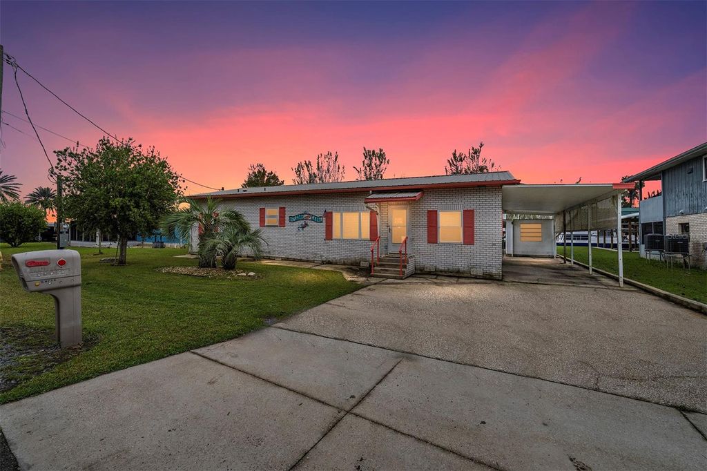 Photo of 24538 Wild Hog Road, Astor, FL 32102 (MLS # O6366014)