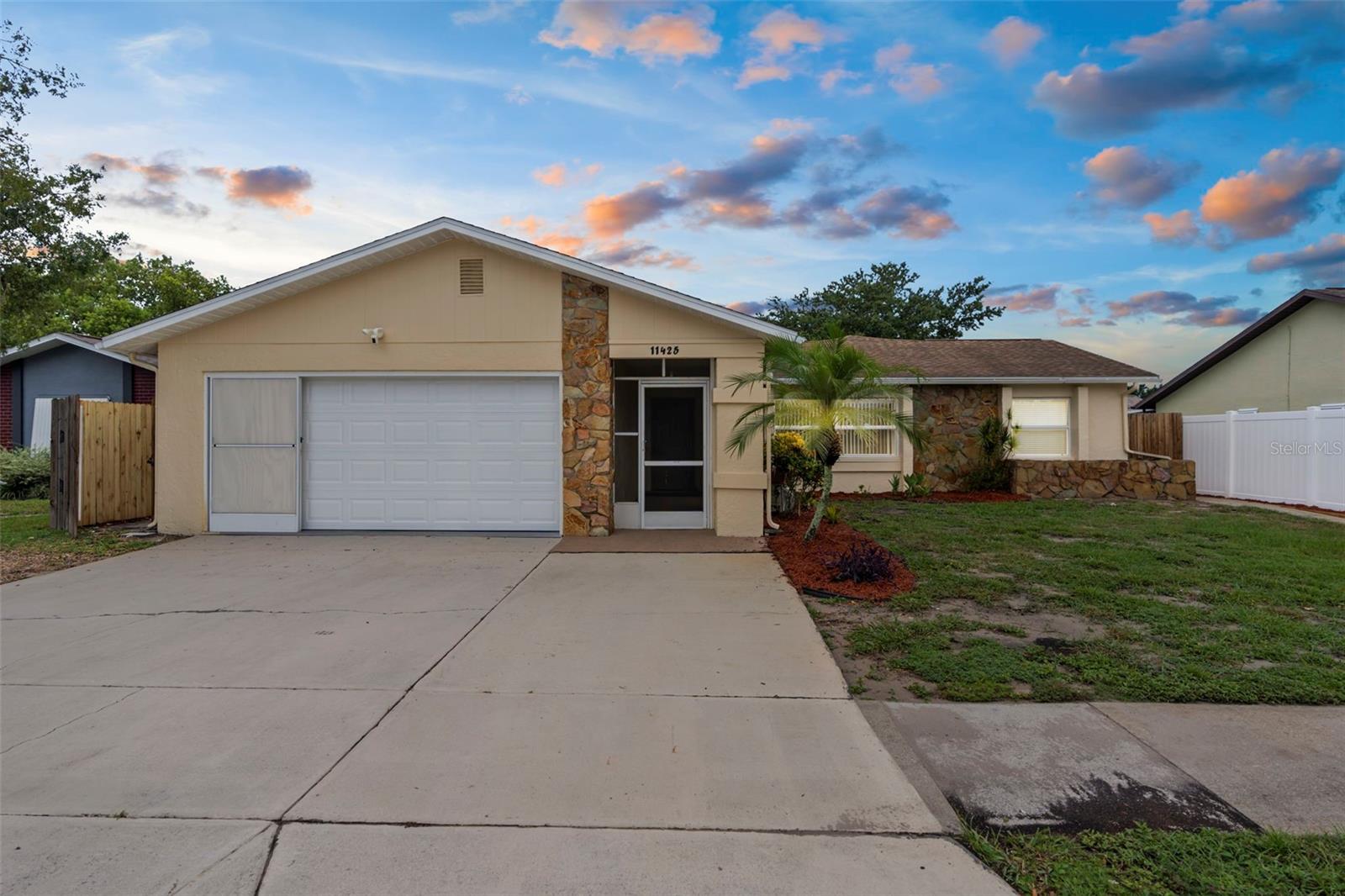 Welcome to This Beautiful 4 Bedroom, 2 Bathroom Home Featuring a 2 Car Garage, 1,839 Sqft of Heated Living Space, and 2,457 Sqft Under Roof. Designed with Comfort and Style in Mind, This Home Offers an Open, Airy, and Inviting Floor Plan with an Open & Split Bedroom Layout for Added Privacy. The Updated Kitchen Showcases Granite Counters, Cherry Wood Cabinets, and Stainless Steel Appliances—Perfect for Everyday Living and Entertaining. Enjoy the Softness of New Carpet in the Bedrooms, with Laminate in Main Living and Tile in Wet Areas. The Interior and Exterior Freshly Painted. Step Outside to a Fully Fenced Yard, Ideal for Relaxation, Pets, or Play. Additional Upgrades Include New Double Pane Windows for Energy Efficiency, a New Roof Installed in 2015, and a New Hot Water Heater 2025. No HOA or CDD Fees, This Home Combines Modern Comfort, Practical Features, and Exceptional Value. You Do Not Want to Miss This Home! Call For a Showing Today!